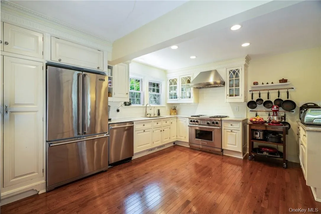 Bright kitchen with ample storage and room for a dining table or portable island Bright kitchen with ample storage and room for a dining table or portable island