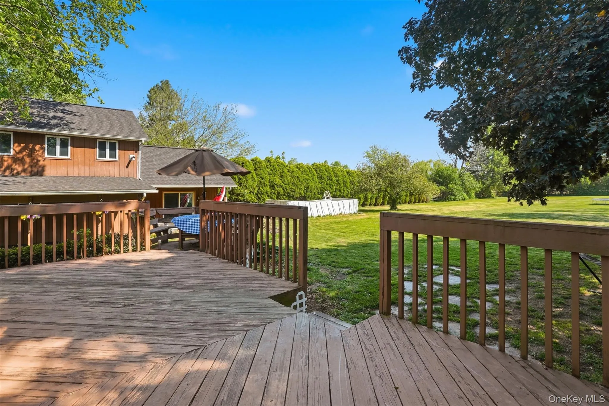 Spacious deck overlooking backyard perfect for entertaining Spacious deck overlooking backyard perfect for entertaining