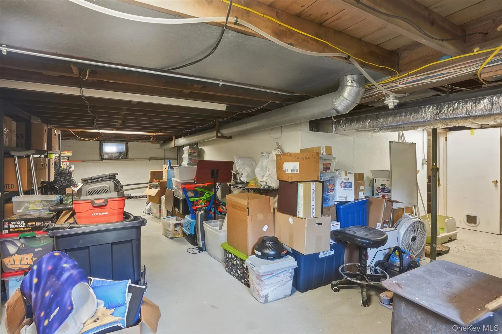 Storage space abounds in this large basement Storage space abounds in this large basement
