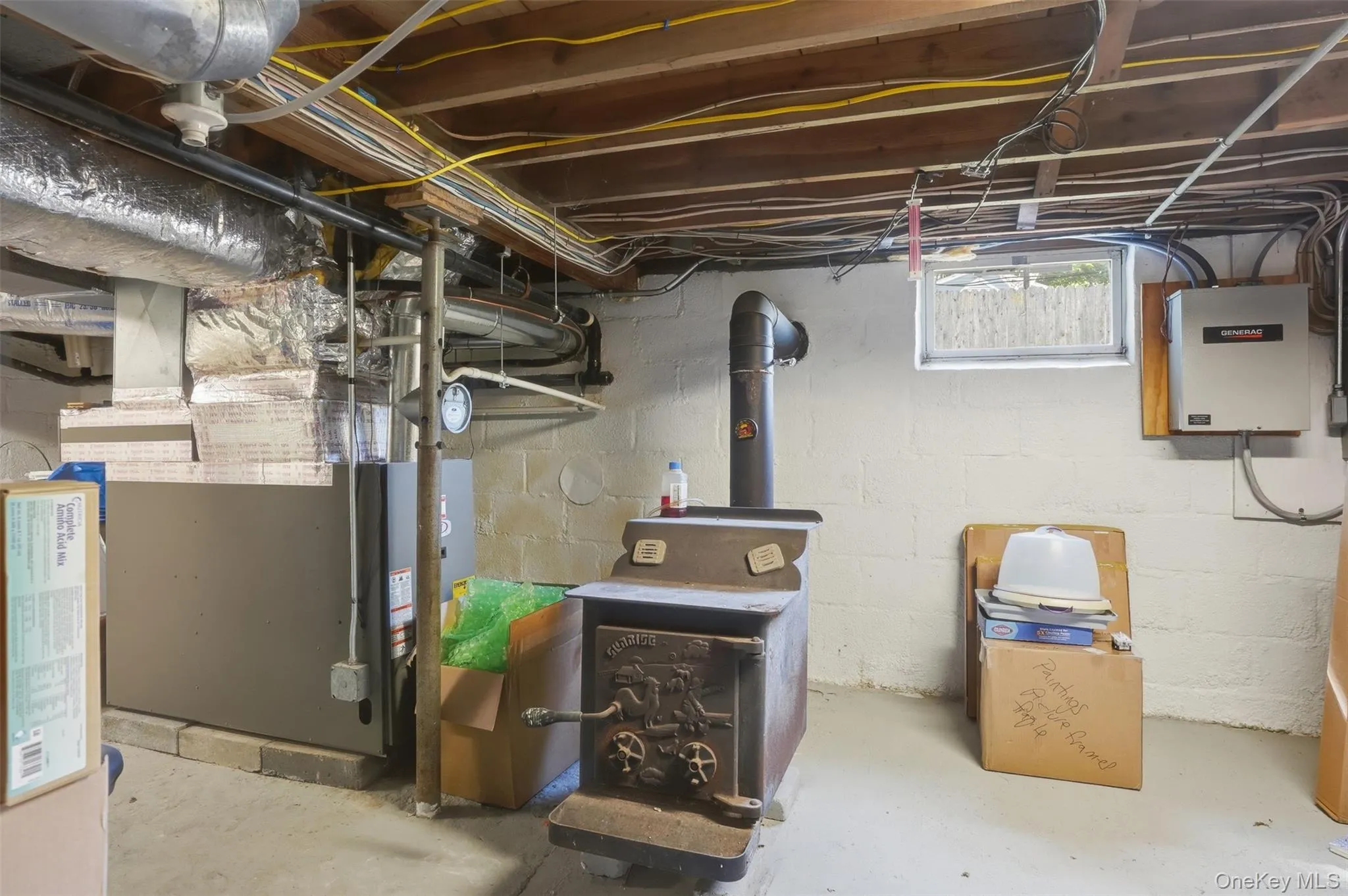 Woodburning stove in the basement is perfect for warming floors and the space Woodburning stove in the basement is perfect for warming floors and the space