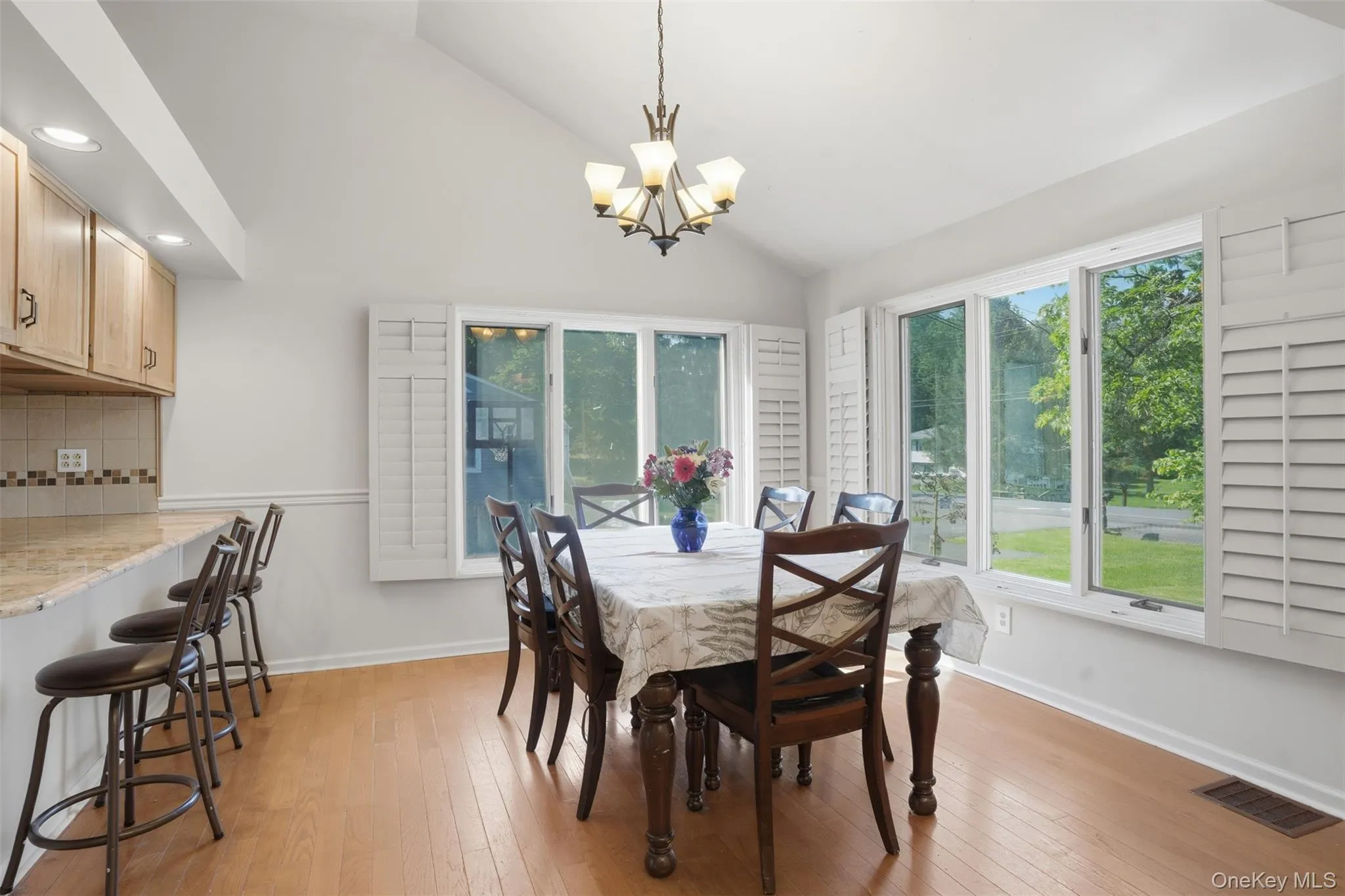 Dining room with plenty of large windows for filling room with natural light Dining room with plenty of large windows for filling room with natural light