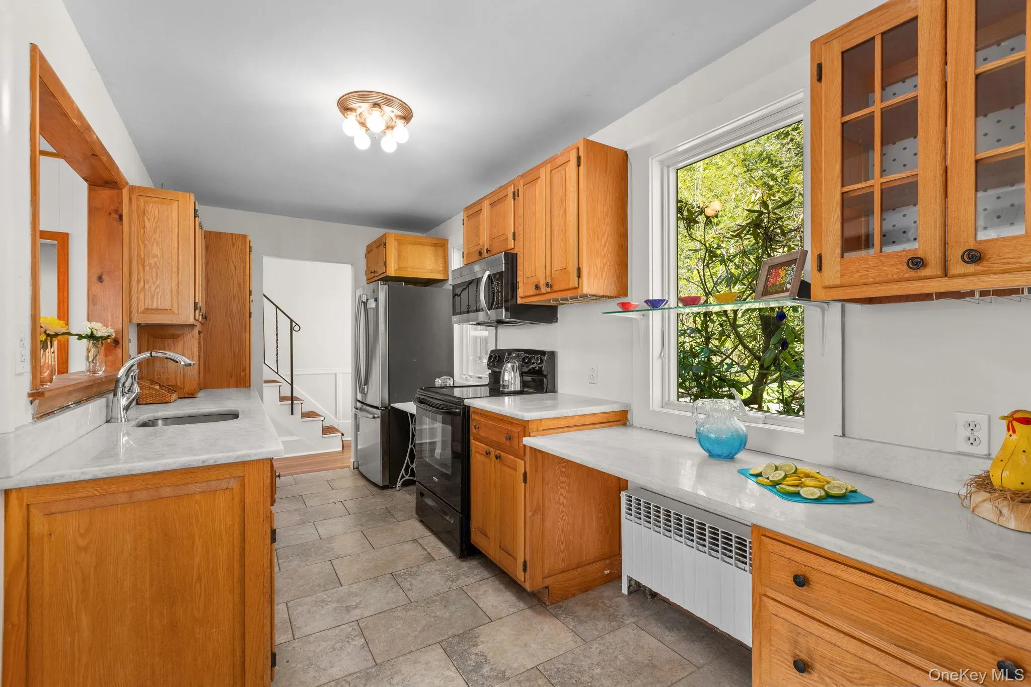 Wider galley styled kitchen offers plenty of cabinetry and counter space Wider galley styled kitchen offers plenty of cabinetry and counter space