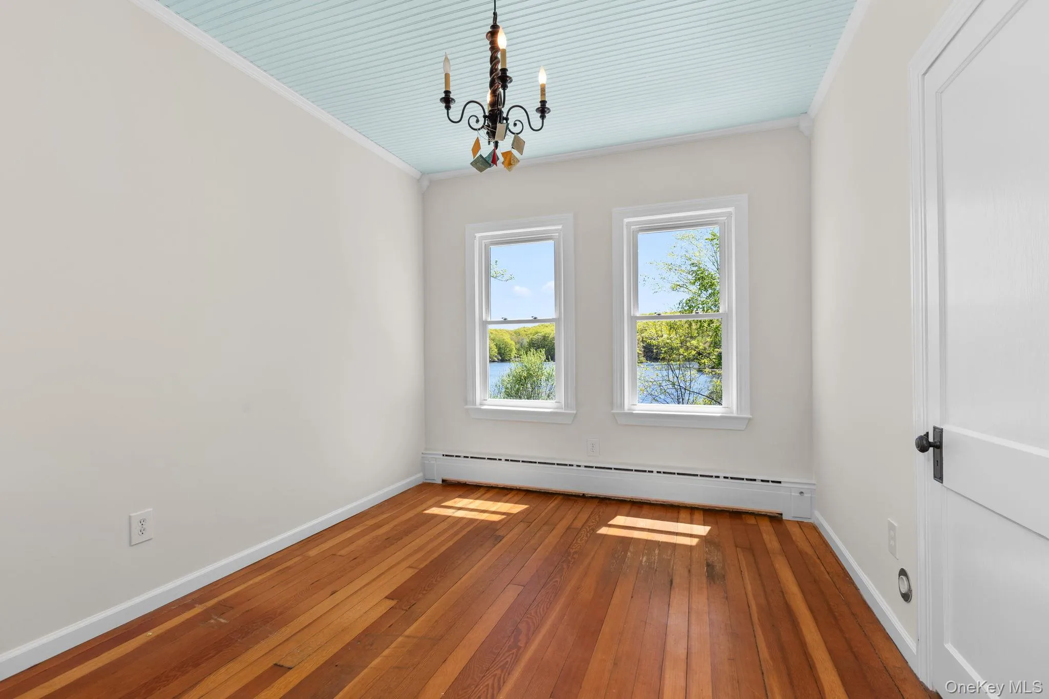 Main level office with lake views and hard wood flooring Main level office with lake views and hard wood flooring