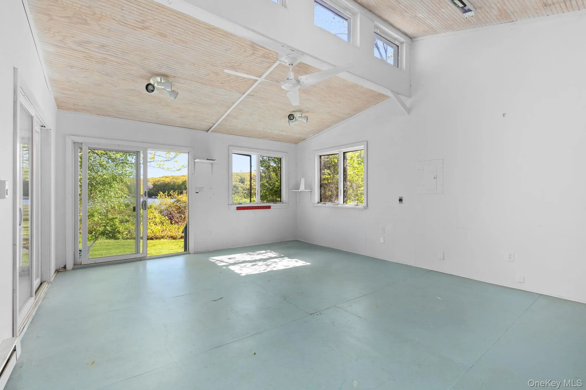 The inside of this space combines high ceiling, sliding doors and plenty of windows capturing natural light and lake views. Art studio, game room, craft space, yoga space-many opportunities to explore The inside of this space combines high ceiling, sliding doors and plenty of windows capturing natural light and lake views. Art studio, game room, craft space, yoga space-many opportunities to explore
