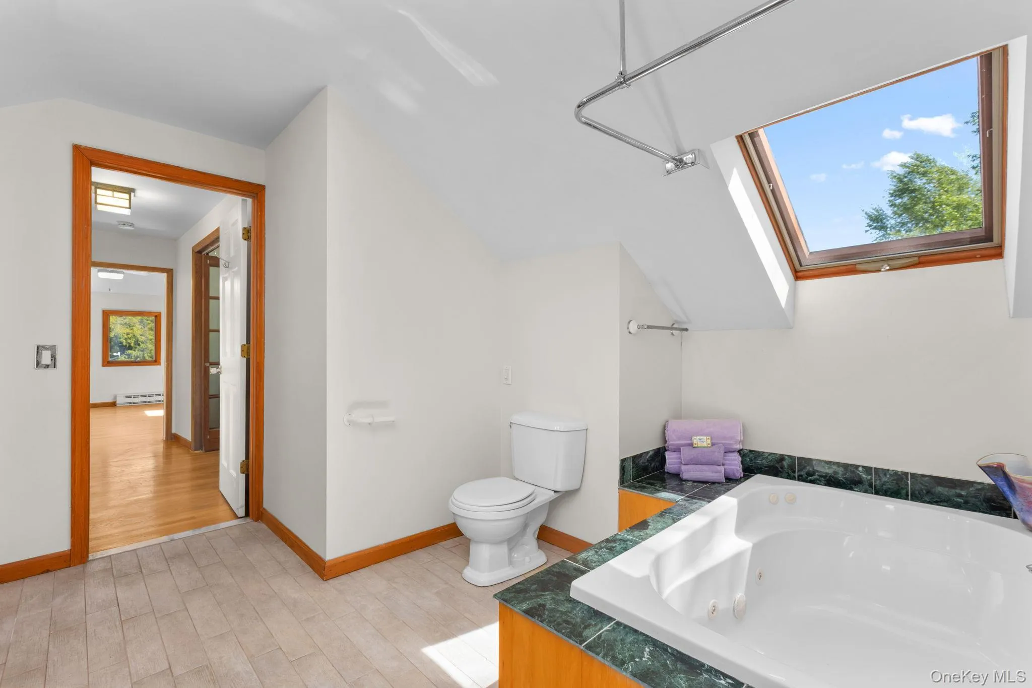 Steps from the bedroom is the home's second bath Steps from the bedroom is the home's second bath