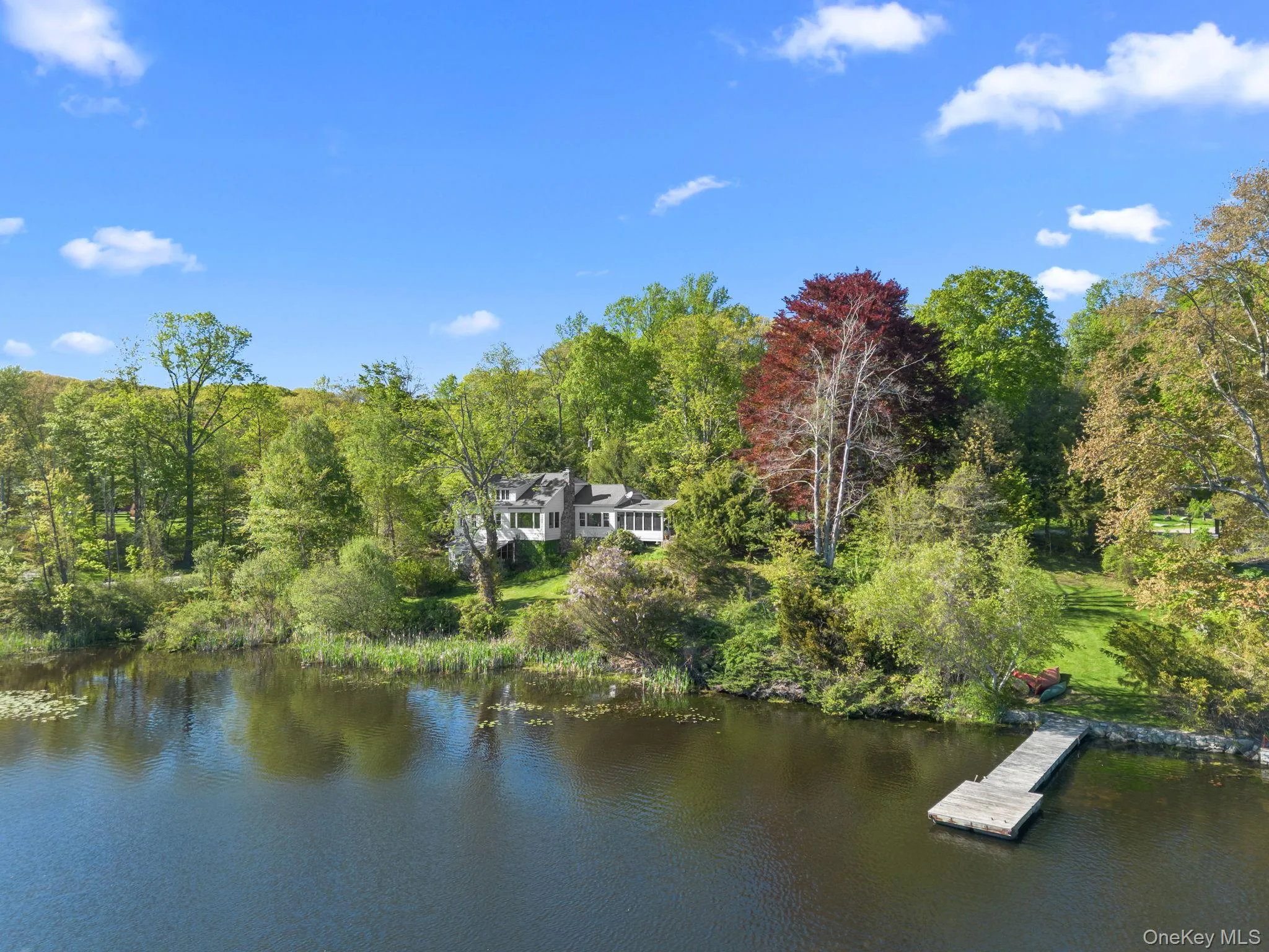 The lakefront home is perfectly placed on more than 1/2 acre of land with panoramic lake views The lakefront home is perfectly placed on more than 1/2 acre of land with panoramic lake views