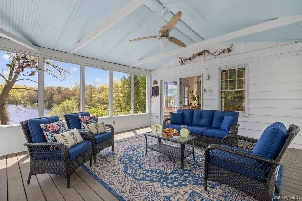 Virtually staged screened porch bring the blues of the lake inside and invokes conversation Virtually staged screened porch bring the blues of the lake inside and invokes conversation
