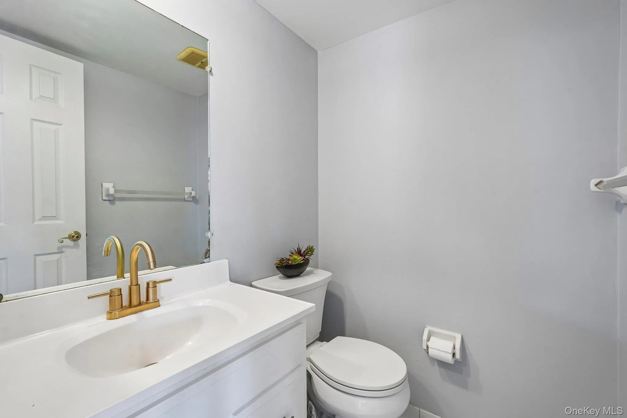 First-floor half bathroom conveniently located for guests and everyday use. First-floor half bathroom conveniently located for guests and everyday use.