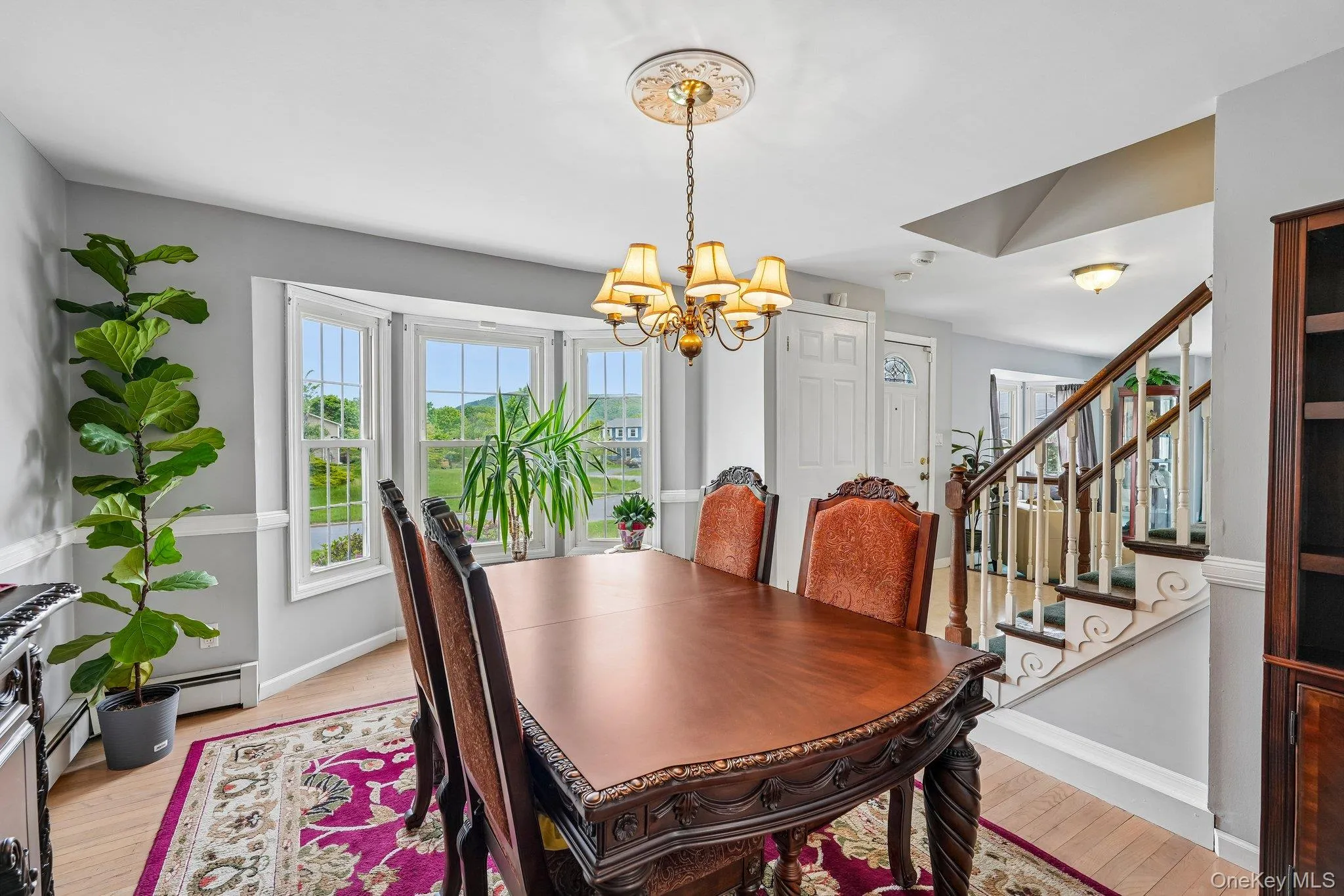 Bright and elegant formal dining room with expansive windows and a well-proportioned layout ideal for everyday meals or special occasions. Bright and elegant formal dining room with expansive windows and a well-proportioned layout ideal for everyday meals or special occasions.