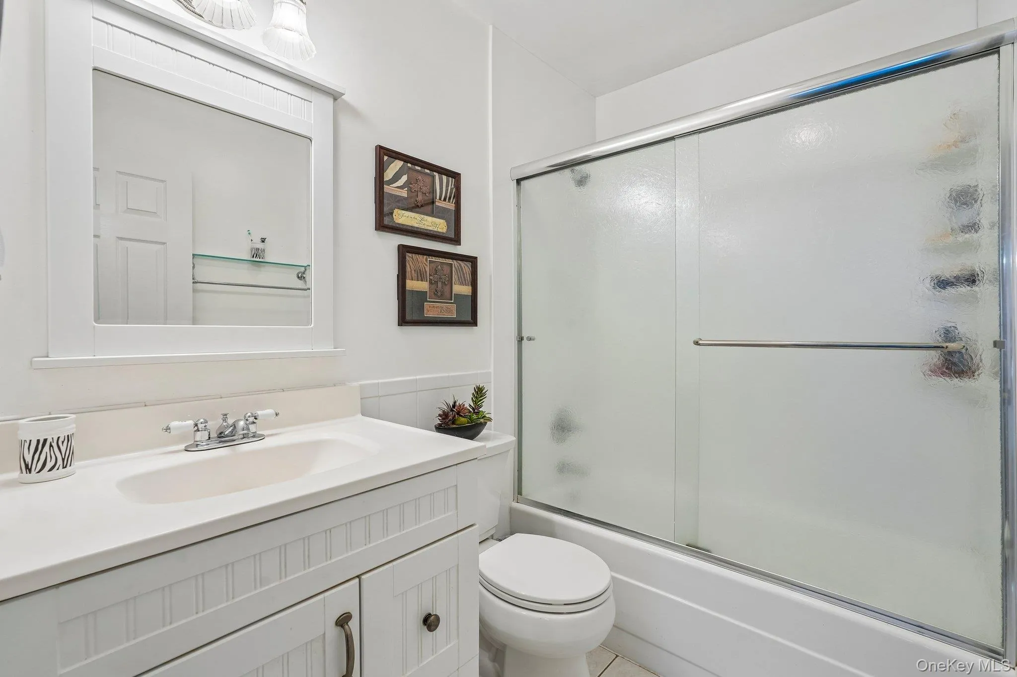 Second-floor full bathroom featuring a tub and shower combination, updated vanity, and bright finishes. Second-floor full bathroom featuring a tub and shower combination, updated vanity, and bright finishes.