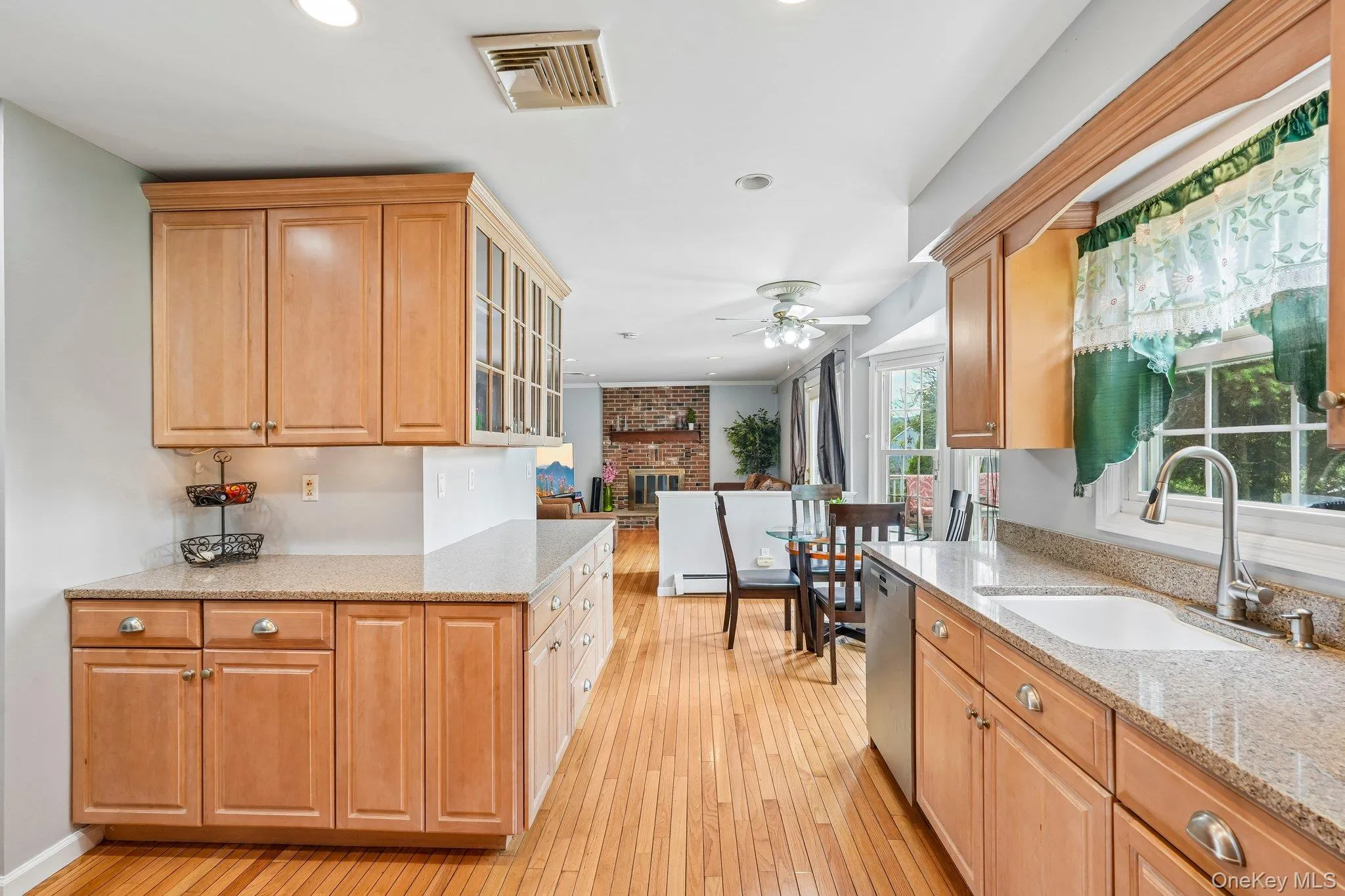 Spacious kitchen featuring abundant cabinetry, ample counter space, and a functional layout designed for everyday living and entertaining. Spacious kitchen featuring abundant cabinetry, ample counter space, and a functional layout designed for everyday living and entertaining.