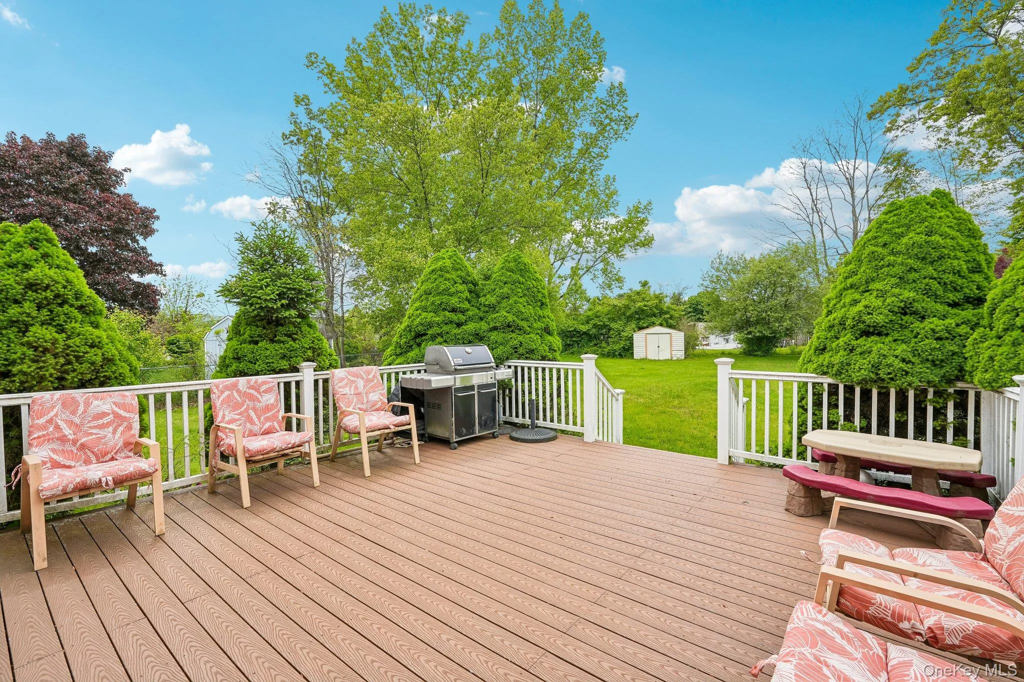 Expansive Trex deck with direct access from the family room, offering an ideal space for outdoor entertaining and relaxation. Expansive Trex deck with direct access from the family room, offering an ideal space for outdoor entertaining and relaxation.