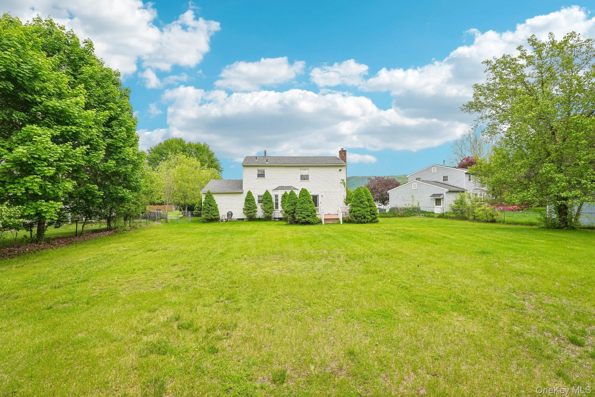 Rear property view showcasing the generous outdoor space ideal for entertaining, play, or relaxation. Rear property view showcasing the generous outdoor space ideal for entertaining, play, or relaxation.