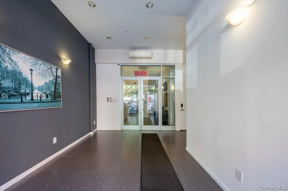 Building lobby featuring recessed lighting Building lobby featuring recessed lighting