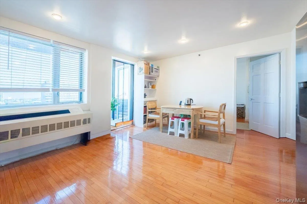 Dining area featuring light wood-type flooring and radiator Dining area featuring light wood-type flooring and radiator