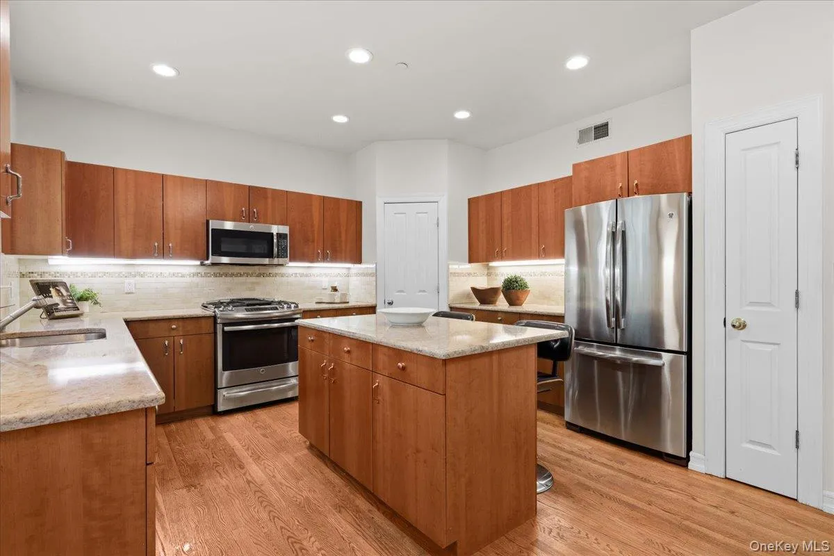 Kitchen with granite countertops and stainless appliances Kitchen with granite countertops and stainless appliances