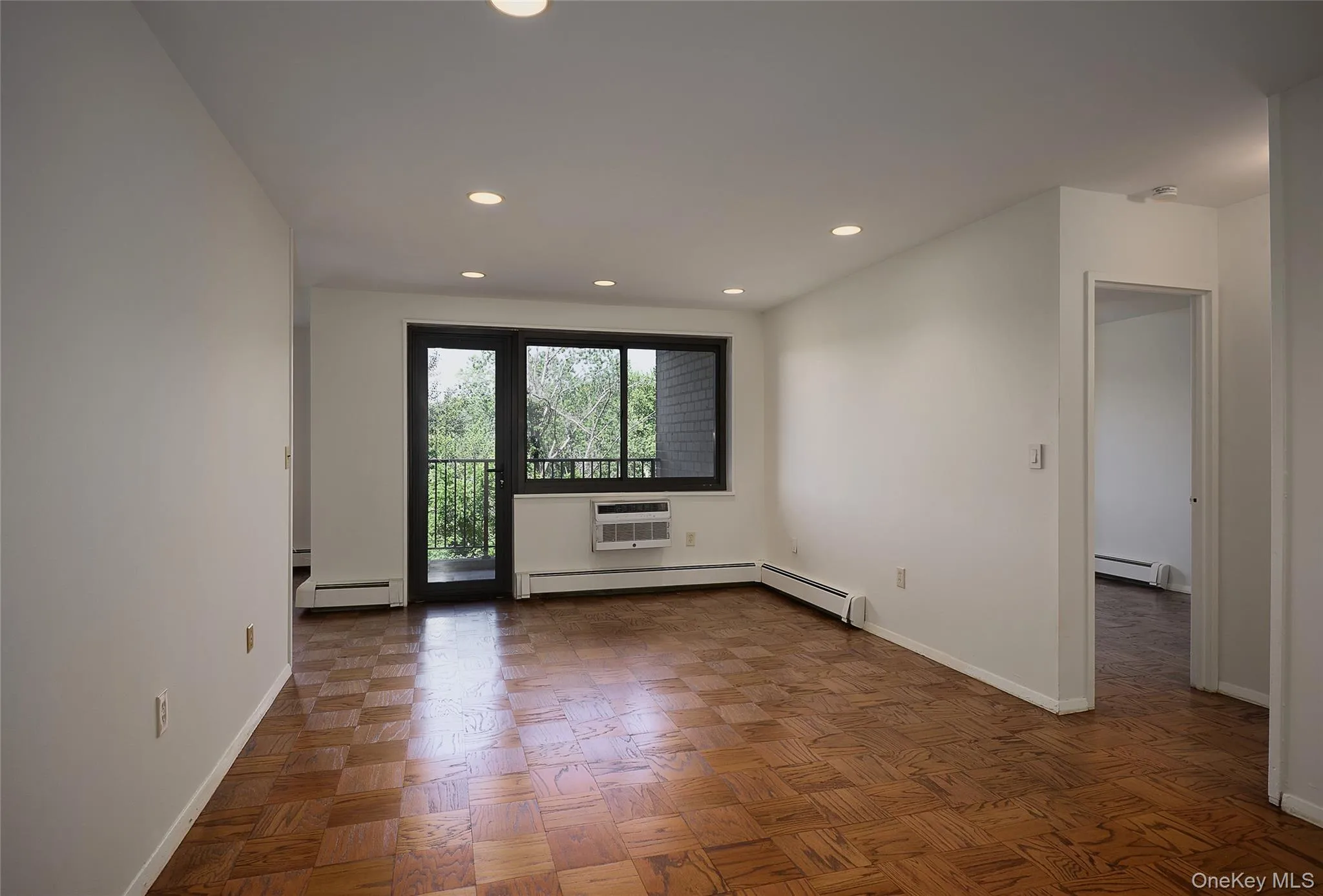 Living Room with view of balcony overlooking the golf course Living Room with view of balcony overlooking the golf course