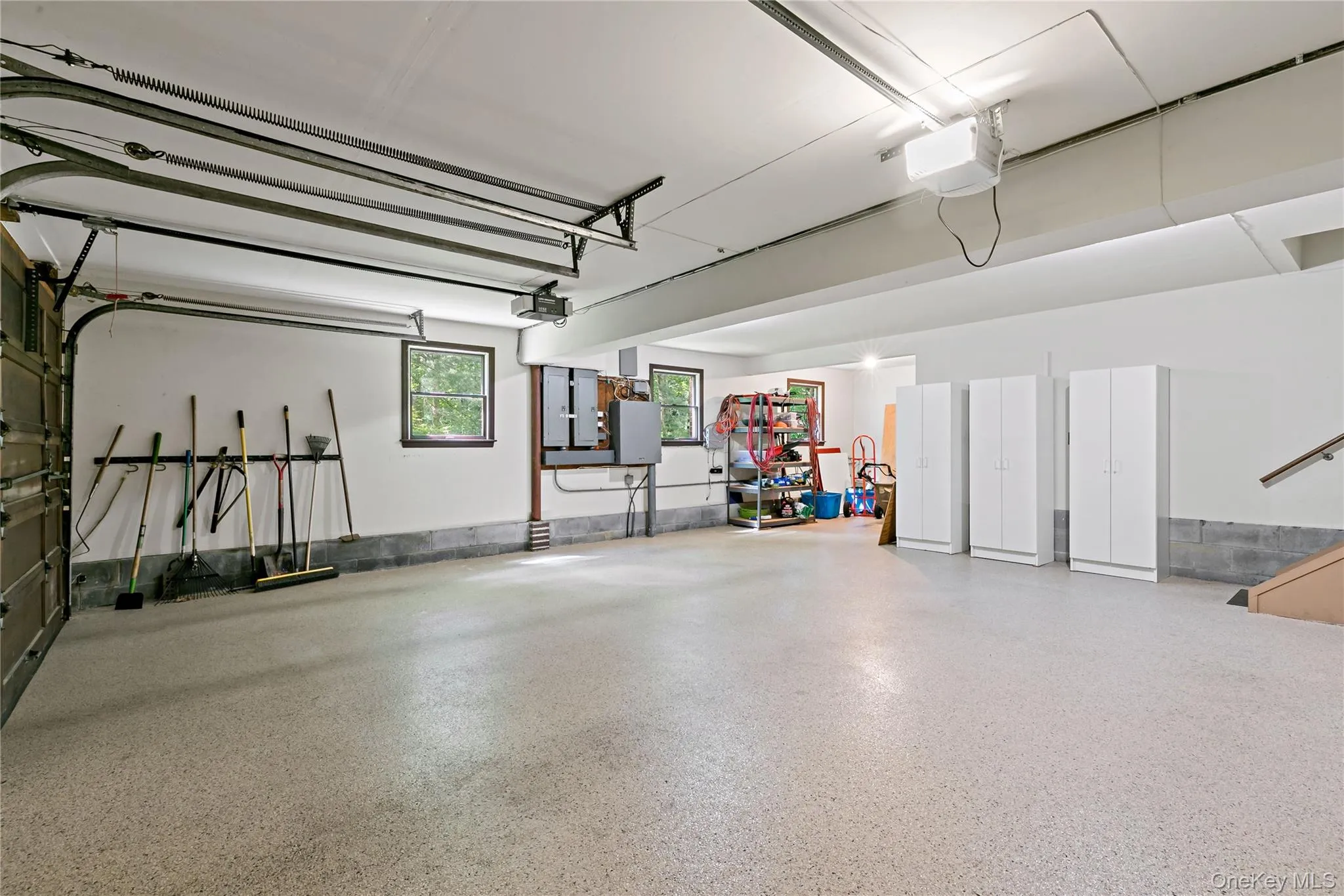 Epoxy floor in a huge two car garage with storage. Epoxy floor in a huge two car garage with storage.