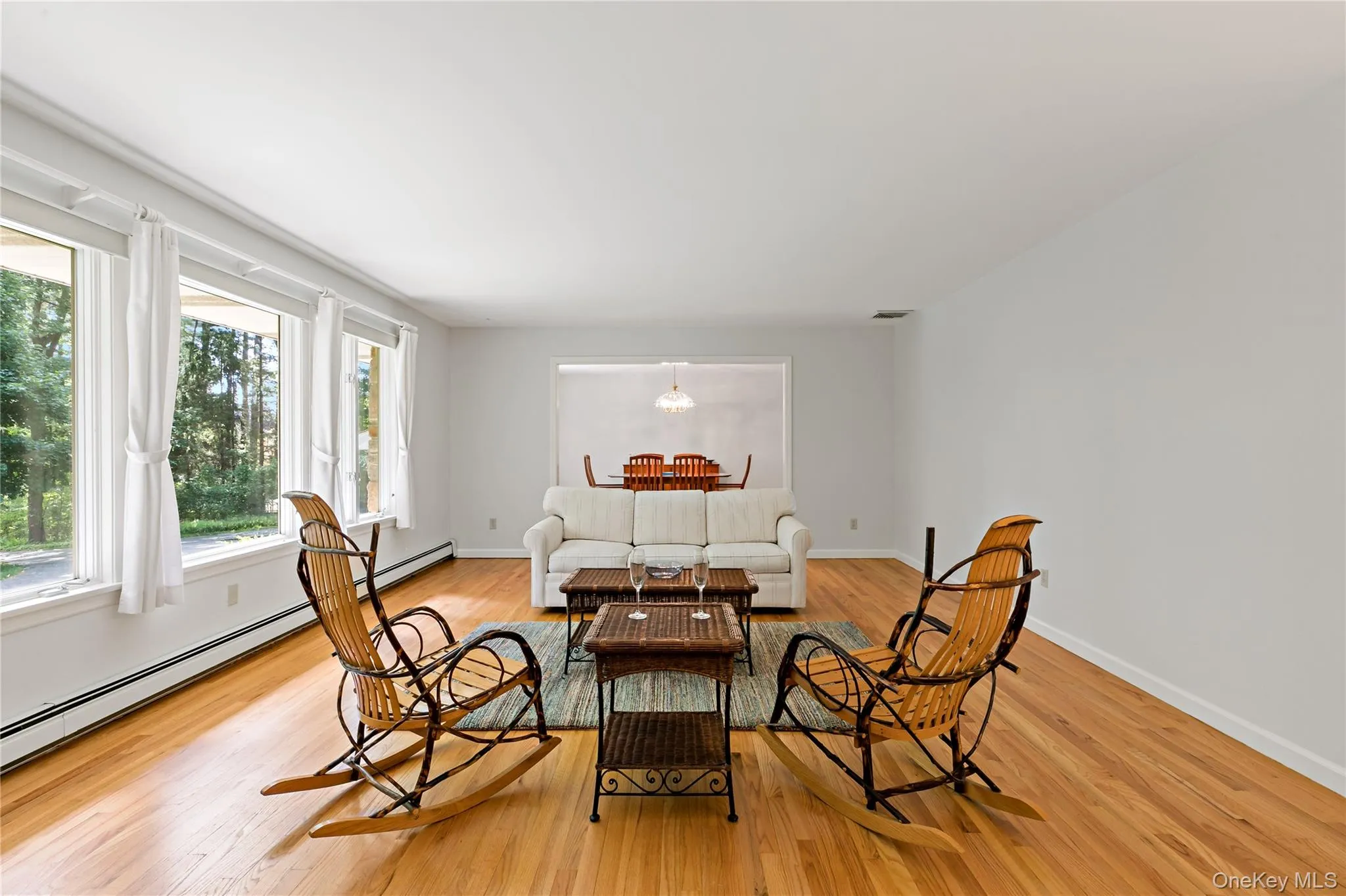 Enormous formal living room with rich hardwood floors. Enormous formal living room with rich hardwood floors.