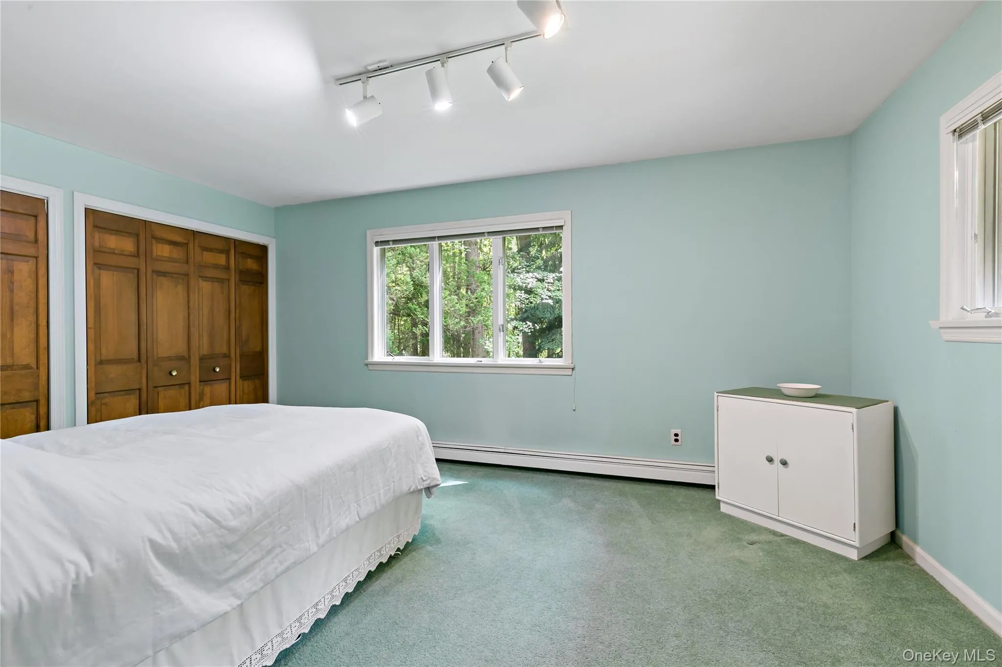Second bedroom with dual closets. Second bedroom with dual closets.