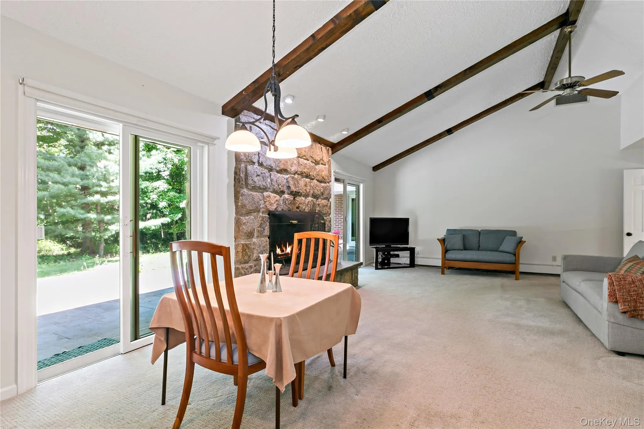The great room encompasses a dining area with one of four sliders to terrace. The great room encompasses a dining area with one of four sliders to terrace.