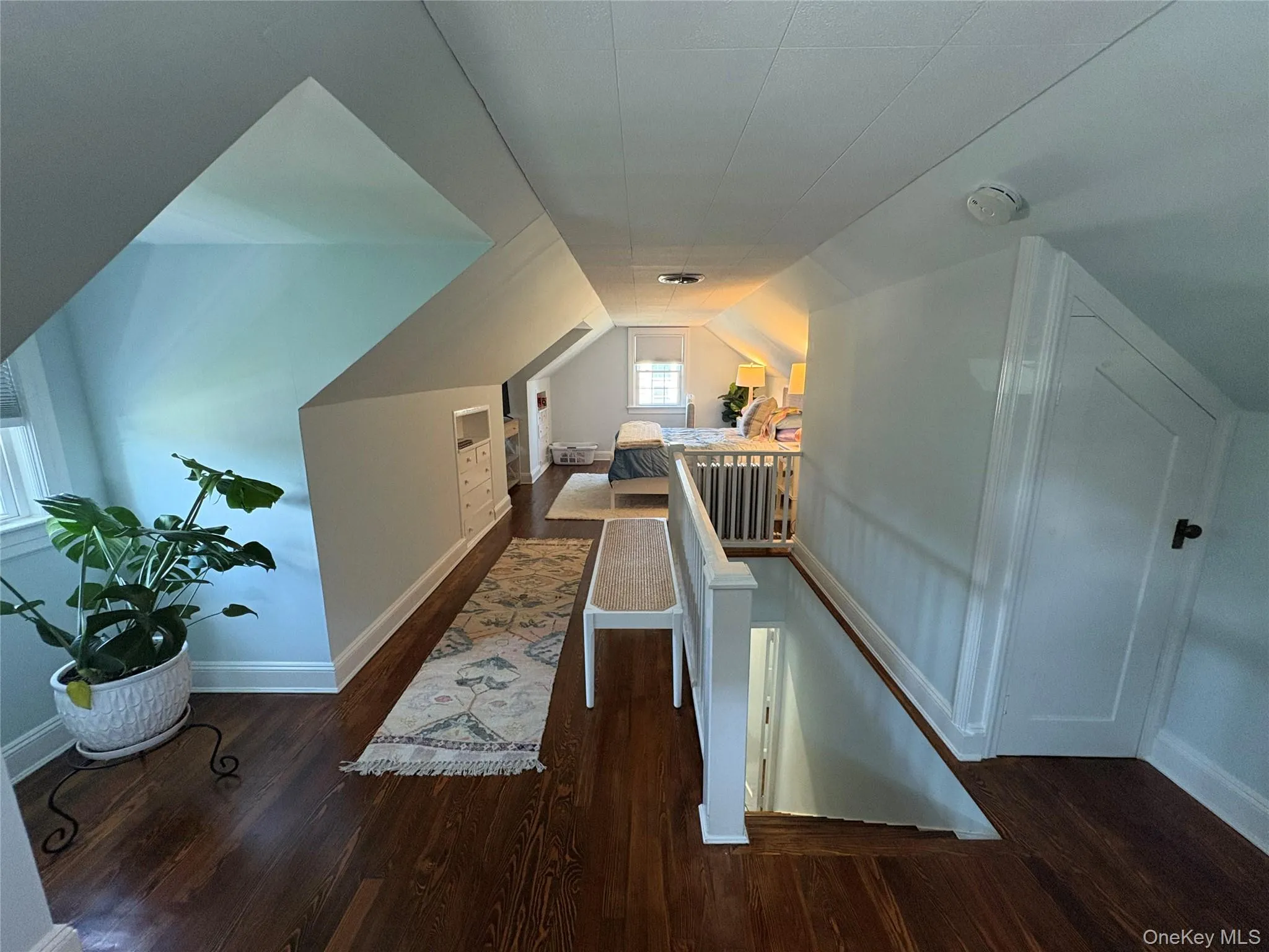 Bonus room featuring wood finished floors and lofted ceiling Bonus room featuring wood finished floors and lofted ceiling
