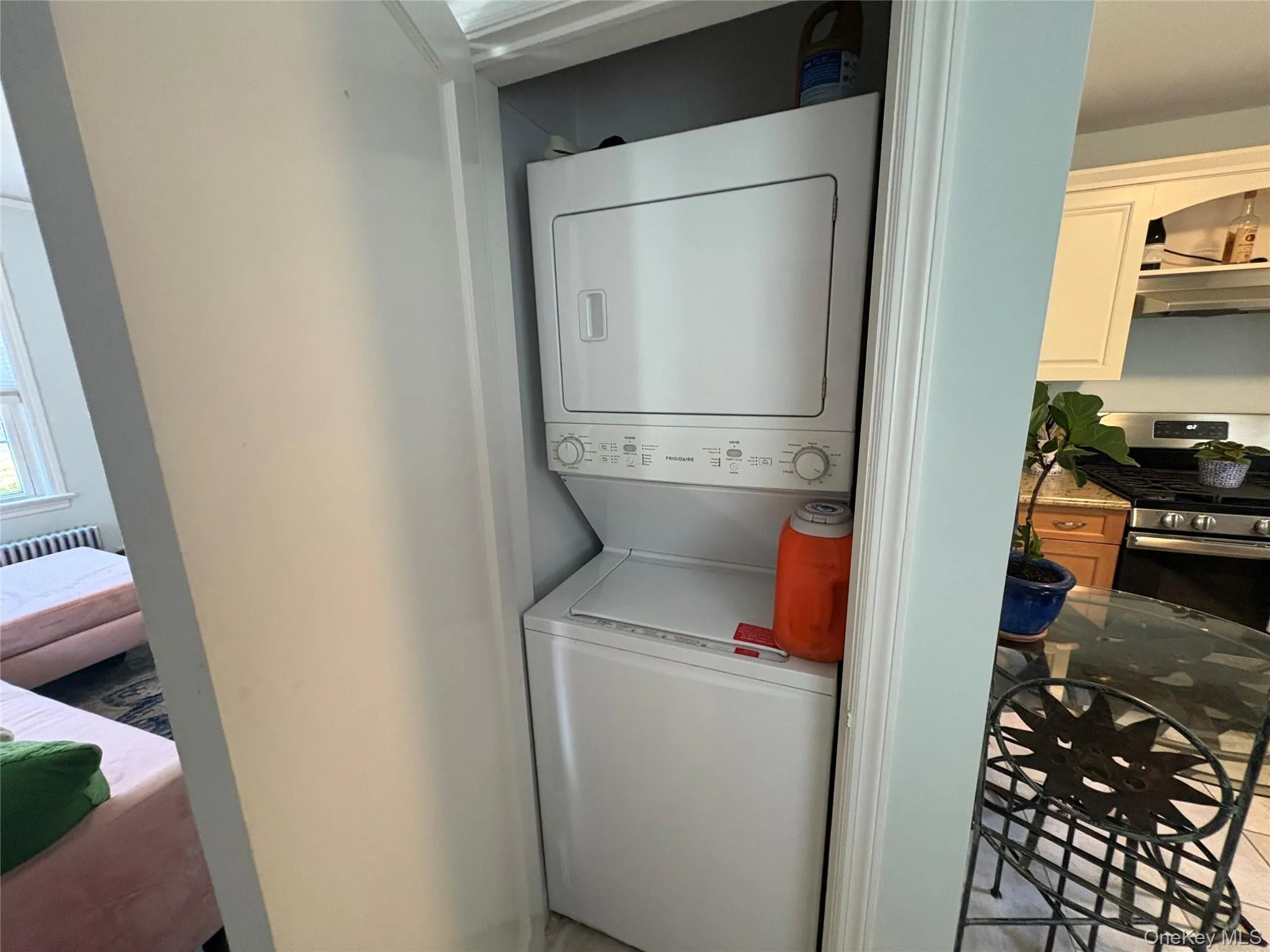 Laundry featuring stacked washing machine and dryer Laundry featuring stacked washing machine and dryer