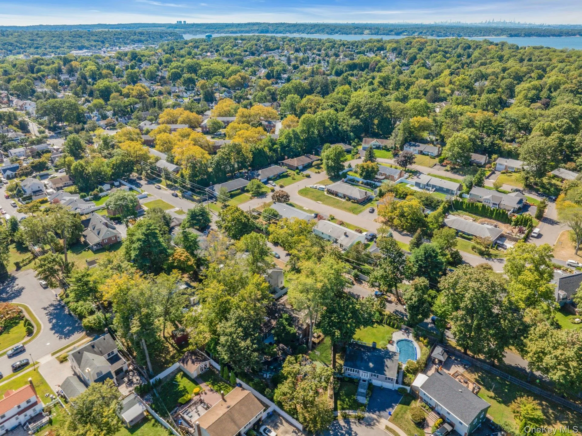 Aerial view of property and surrounding area with nearby suburban area Aerial view of property and surrounding area with nearby suburban area