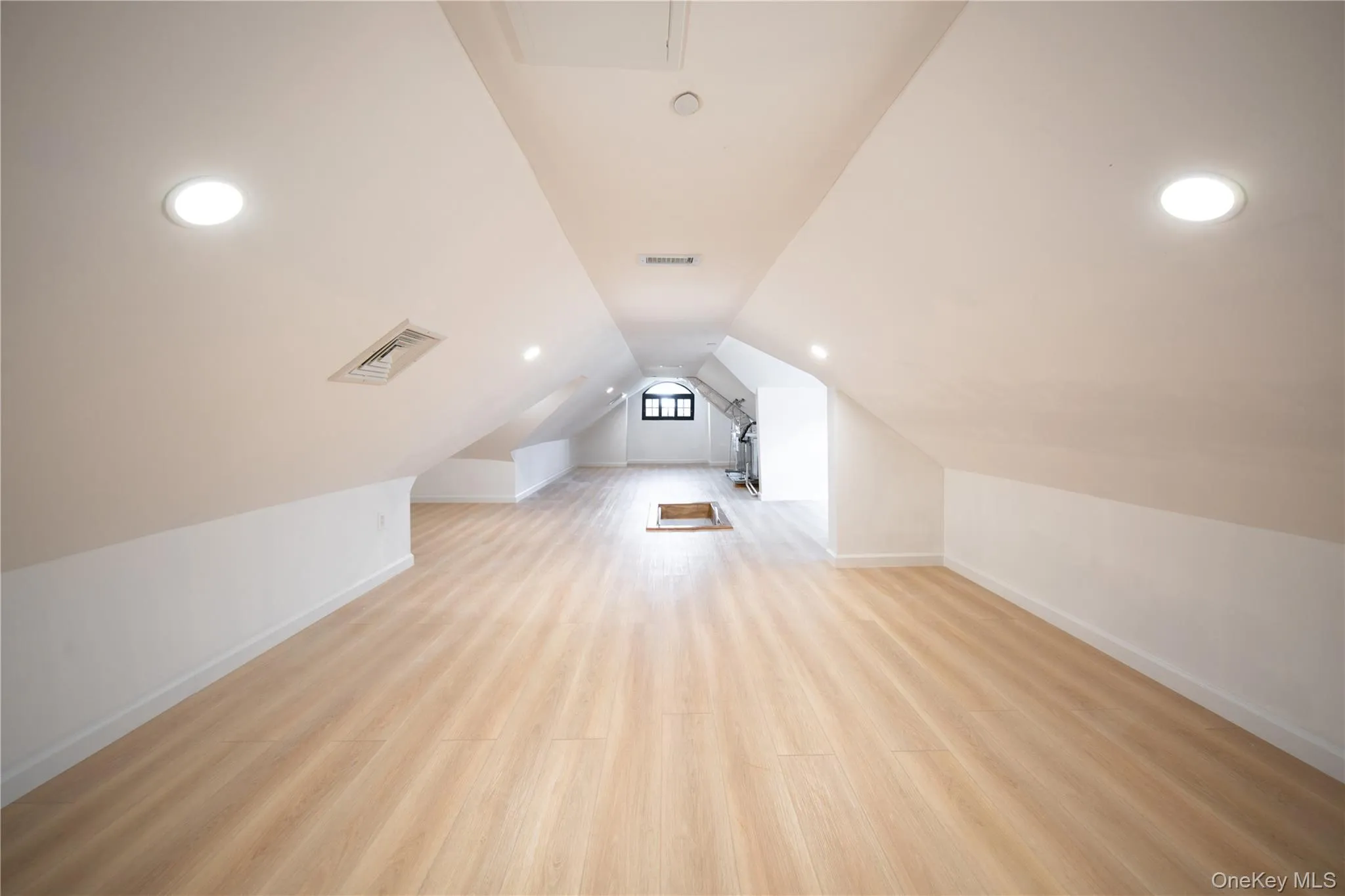 Bonus room with light wood-style flooring, vaulted ceiling, and recessed lighting Bonus room with light wood-style flooring, vaulted ceiling, and recessed lighting