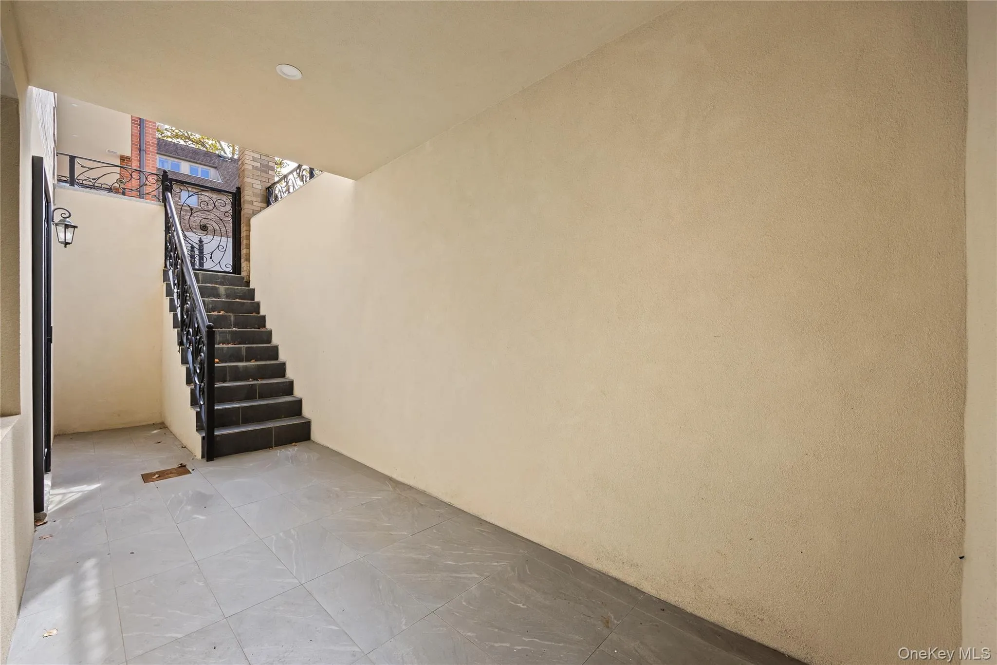 Below grade area with stairway and recessed lighting Below grade area with stairway and recessed lighting