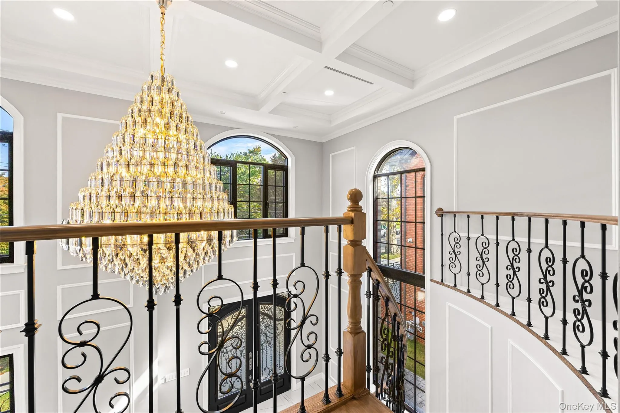 Hallway featuring beam ceiling, coffered ceiling, wood finished floors, crown molding, and recessed lighting Hallway featuring beam ceiling, coffered ceiling, wood finished floors, crown molding, and recessed lighting