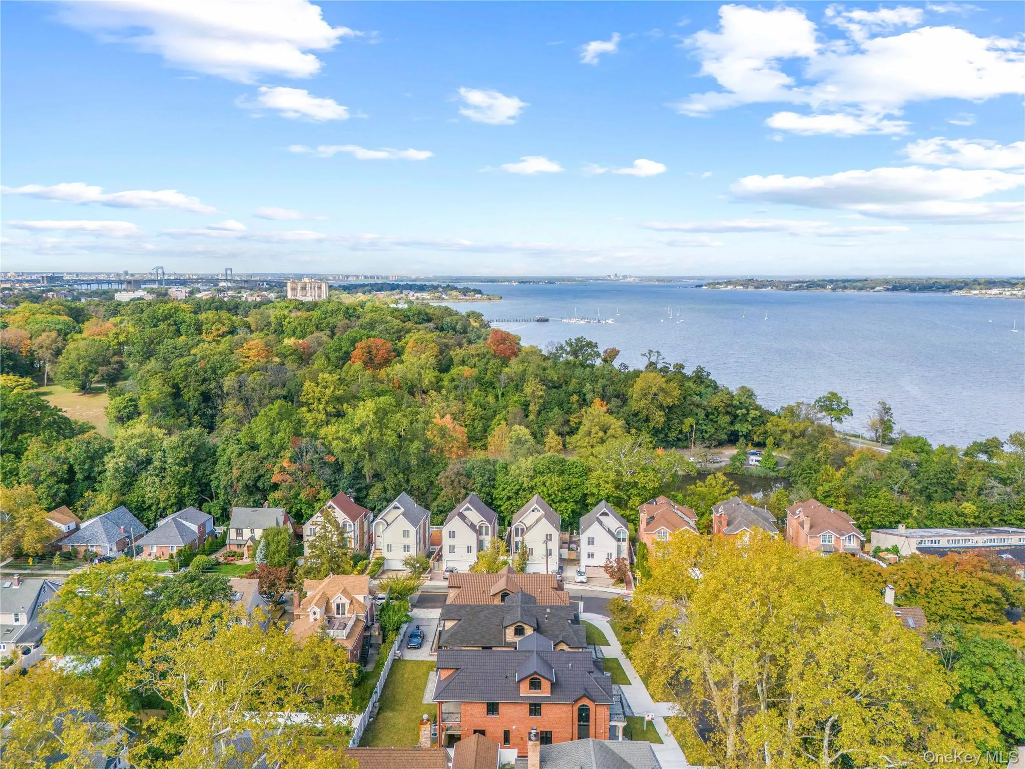 Aerial perspective of suburban area with a large body of water Aerial perspective of suburban area with a large body of water