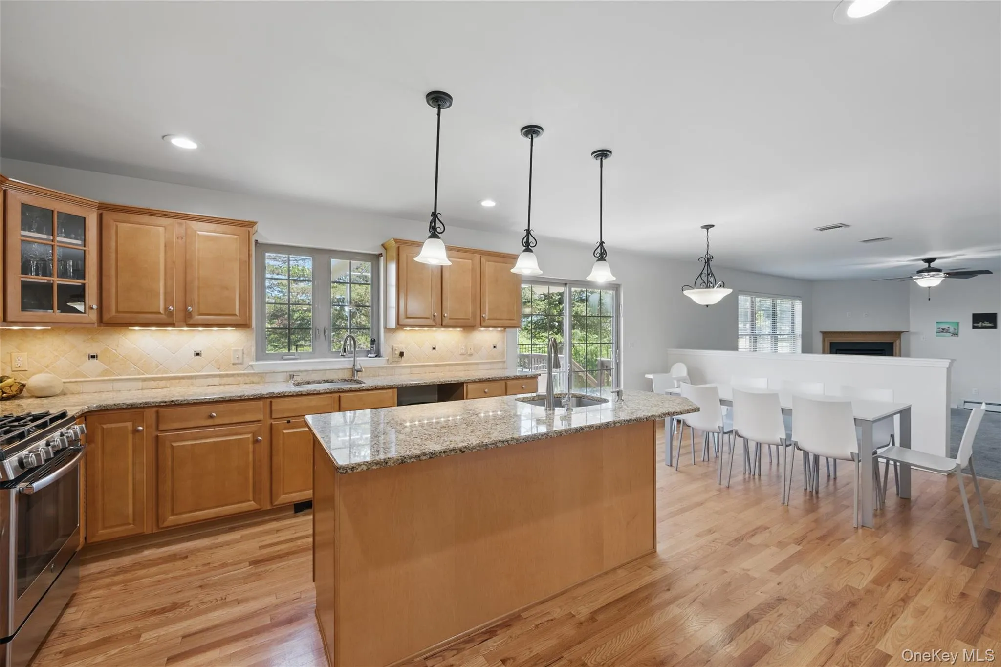 Kitchen featuring a sink, gas stove, healthy amount of natural light, and recessed lighting Kitchen featuring a sink, gas stove, healthy amount of natural light, and recessed lighting