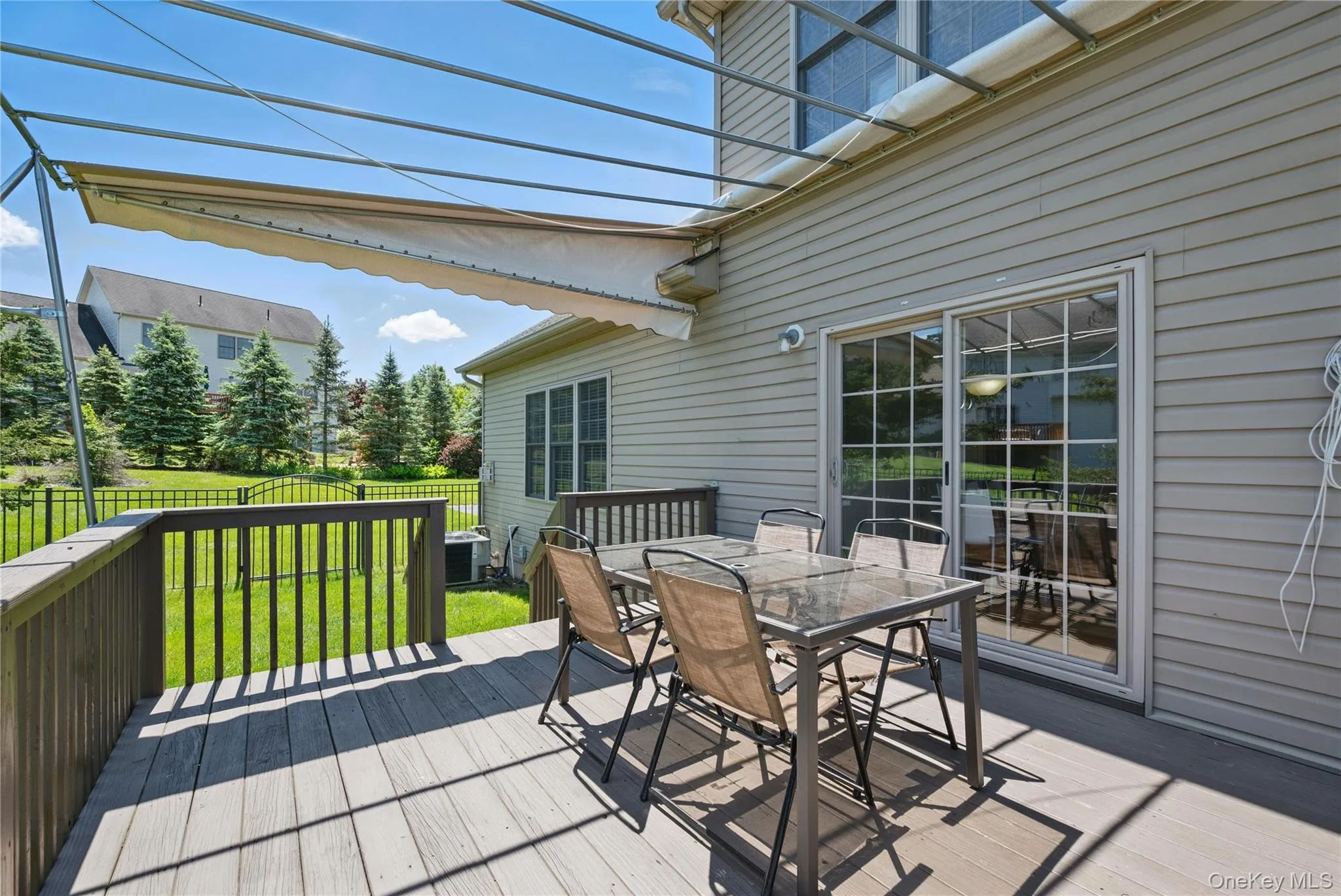 Wooden terrace with outdoor dining area and cooling unit Wooden terrace with outdoor dining area and cooling unit
