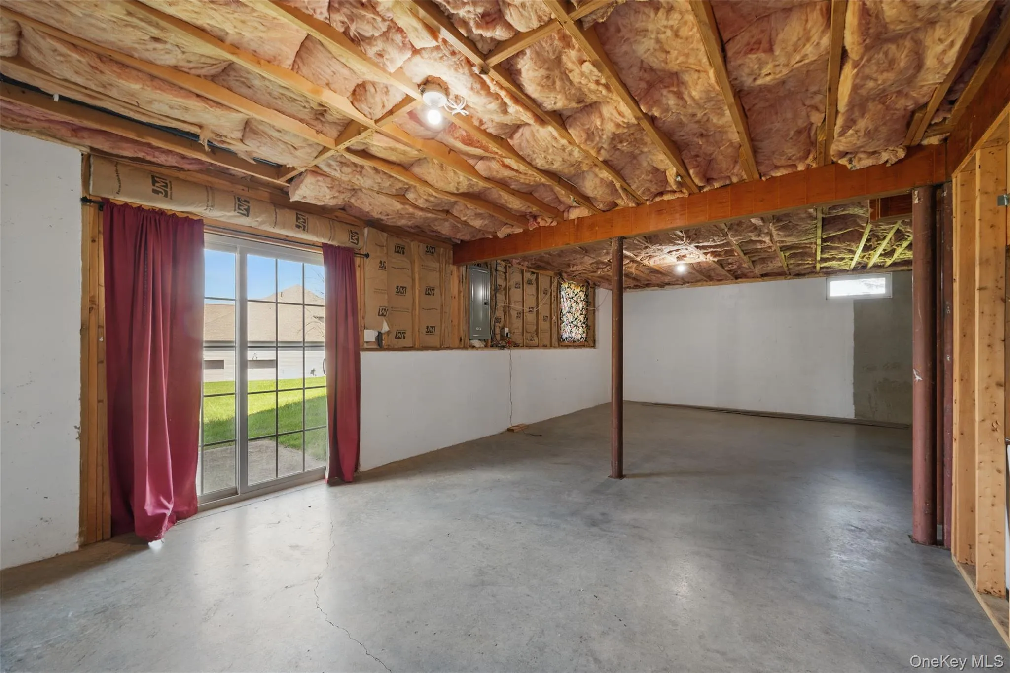 Below grade area featuring electric panel Below grade area featuring electric panel