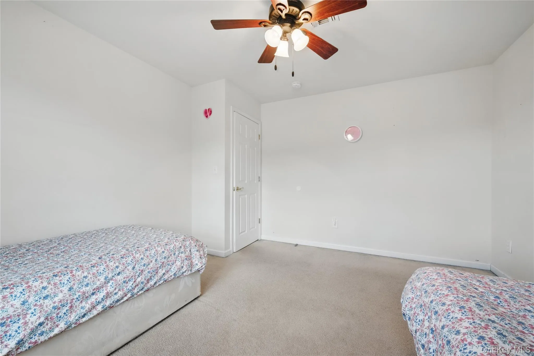 Bedroom featuring carpet, baseboards, and a ceiling fan Bedroom featuring carpet, baseboards, and a ceiling fan