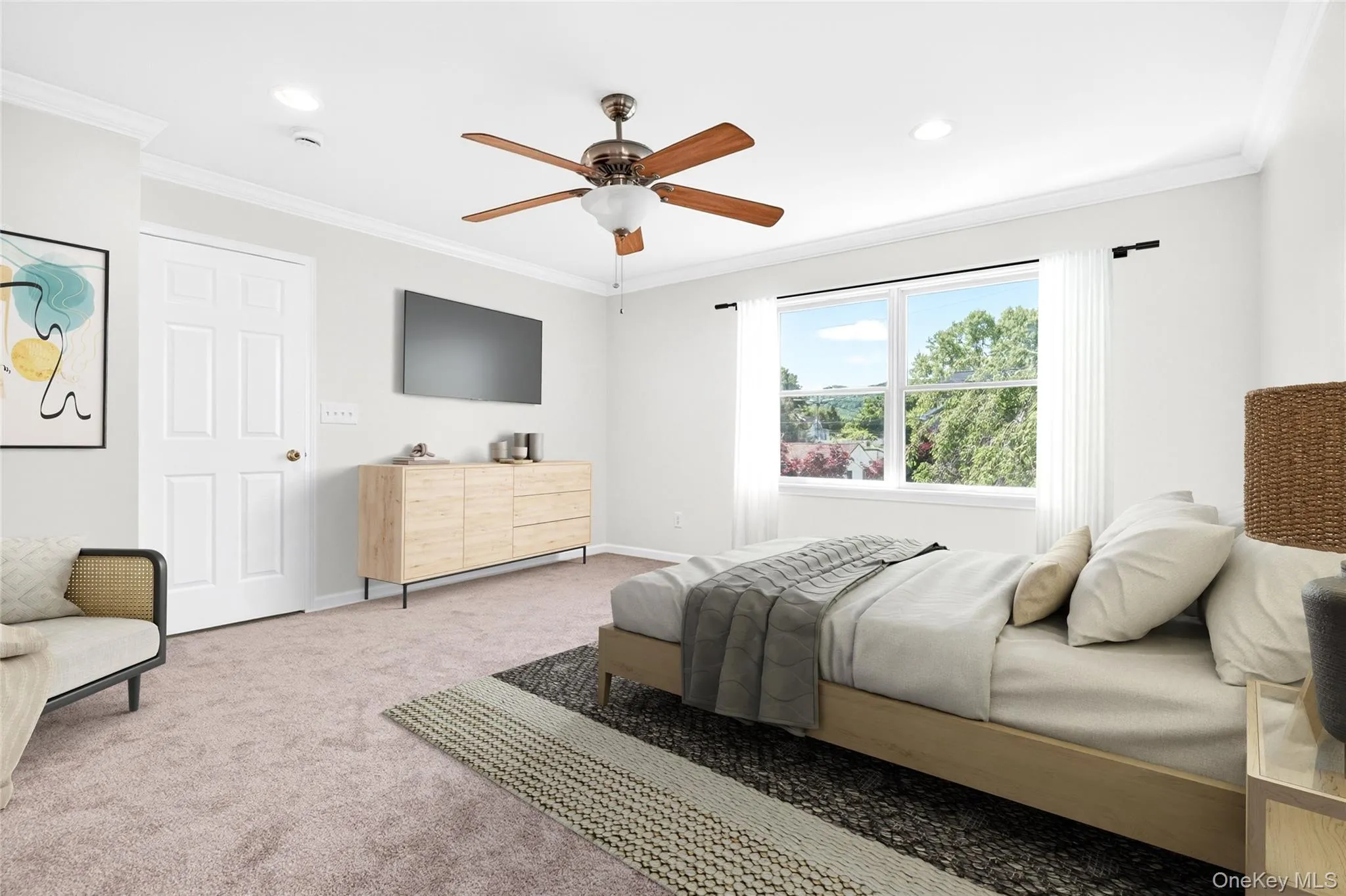 Virtually staged primary bedroom highlighting crown molding, room scale, and design potential Virtually staged primary bedroom highlighting crown molding, room scale, and design potential
