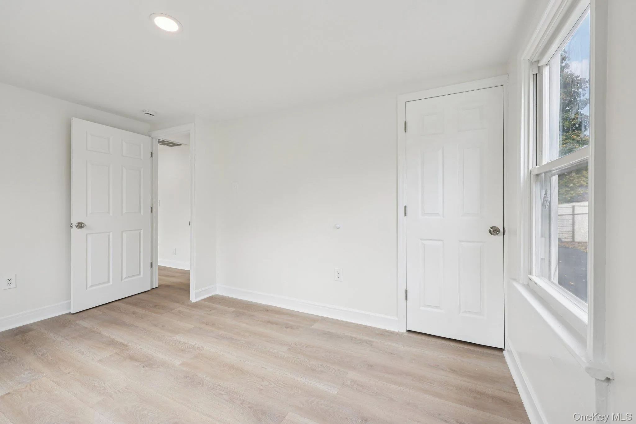 Versatile first floor room ideal for a home office, guest room, or additional living space Versatile first floor room ideal for a home office, guest room, or additional living space