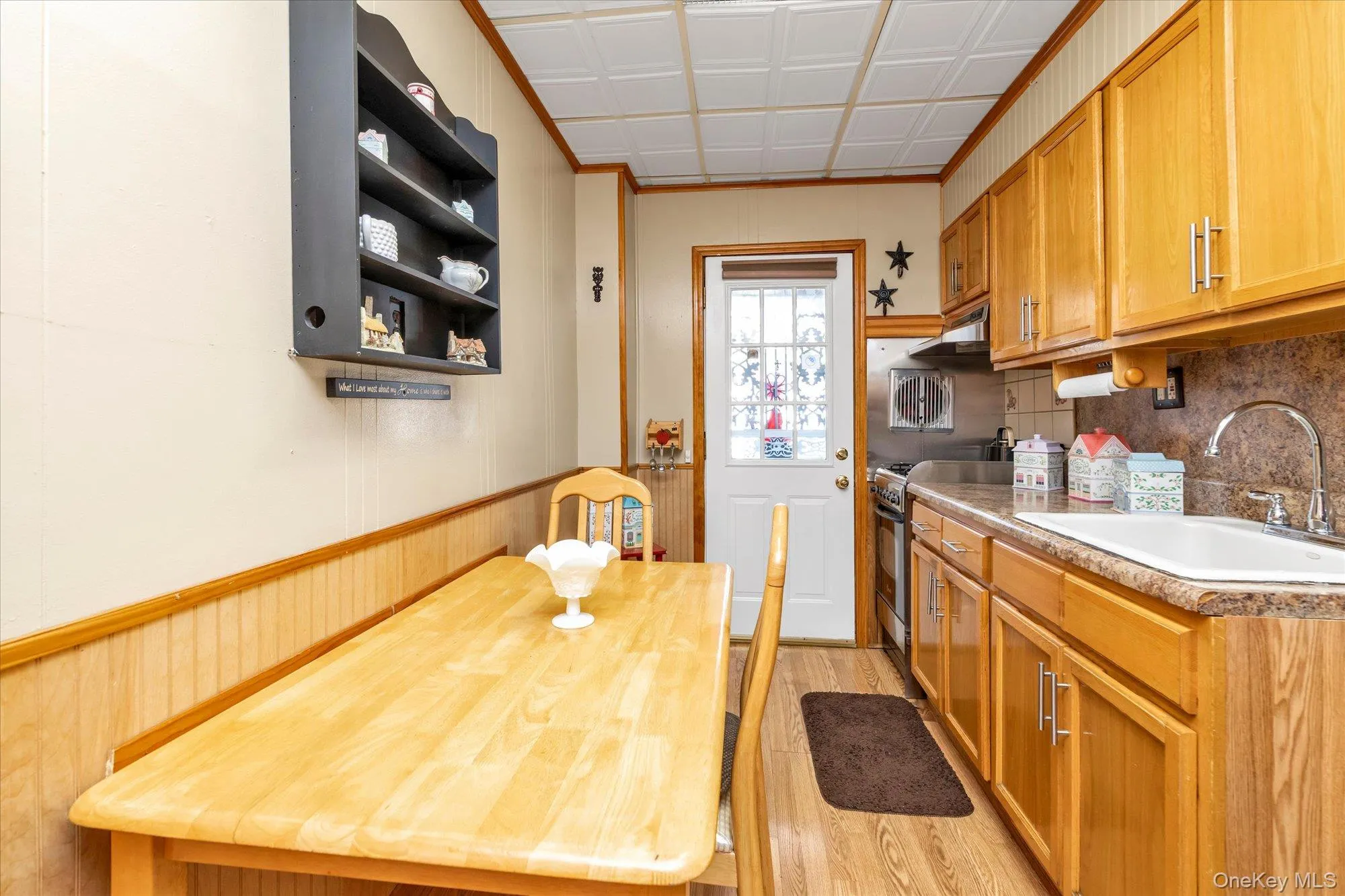 Kitchen featuring light wood-finish cabinetry and a complementary light countertop Kitchen featuring light wood-finish cabinetry and a complementary light countertop