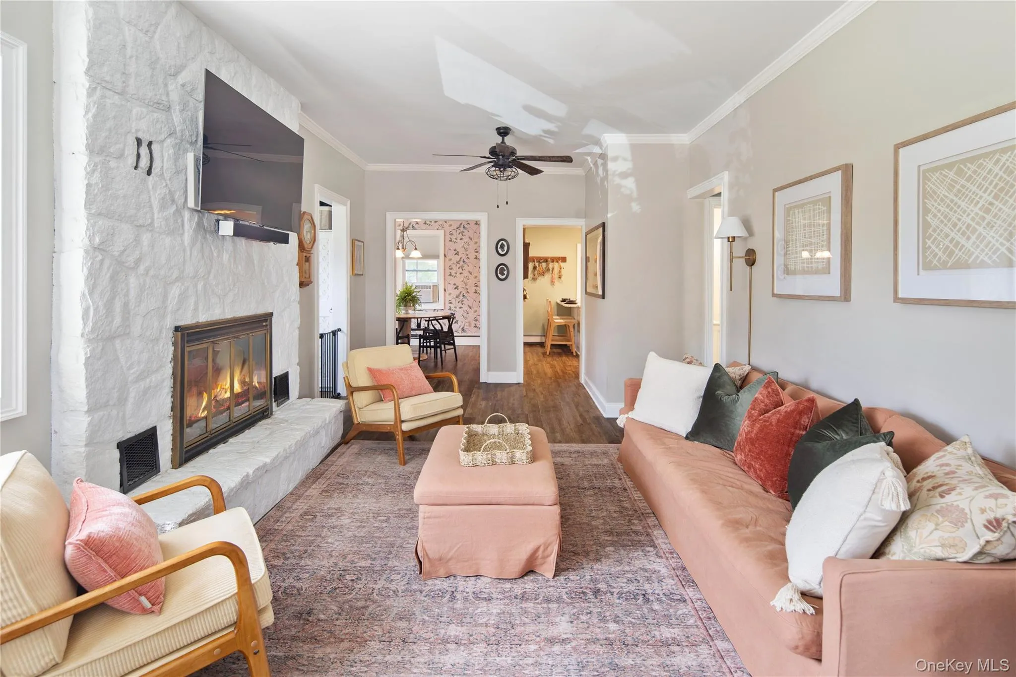 Living room with working fireplace looking into dining area Living room with working fireplace looking into dining area