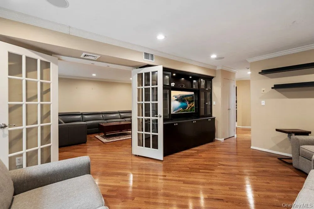 Living Room through double door entry to Den Living Room through double door entry to Den