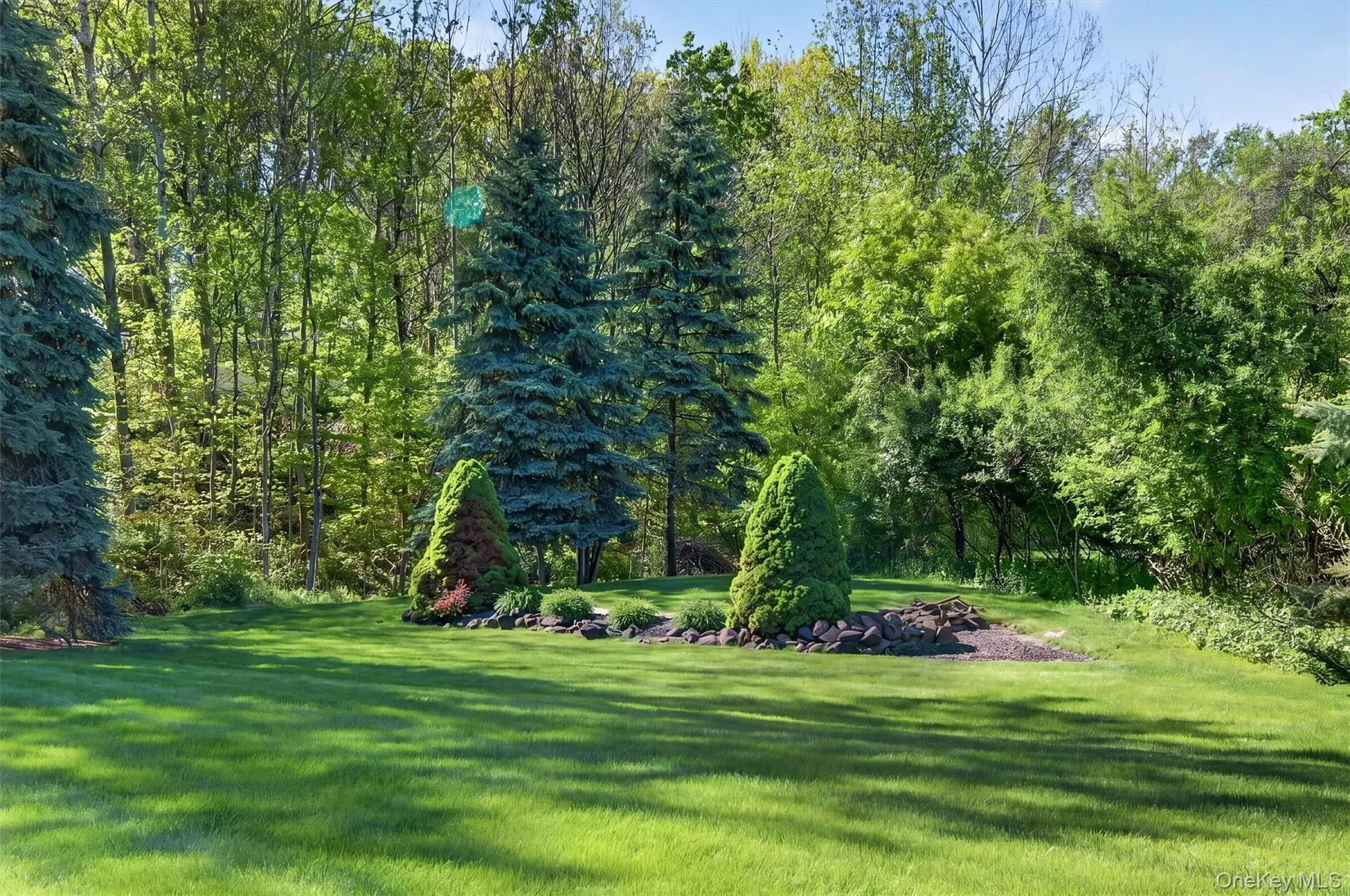 The back yard is a page out of House Beautiful. Yes, you own past the trees! The back yard is a page out of House Beautiful. Yes, you own past the trees!