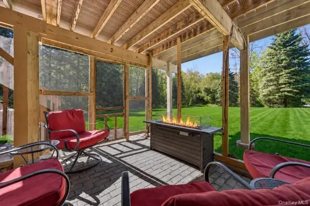 The lower level has a walk out to the screened in back patio where the third fireplace is. The lower level has a walk out to the screened in back patio where the third fireplace is.
