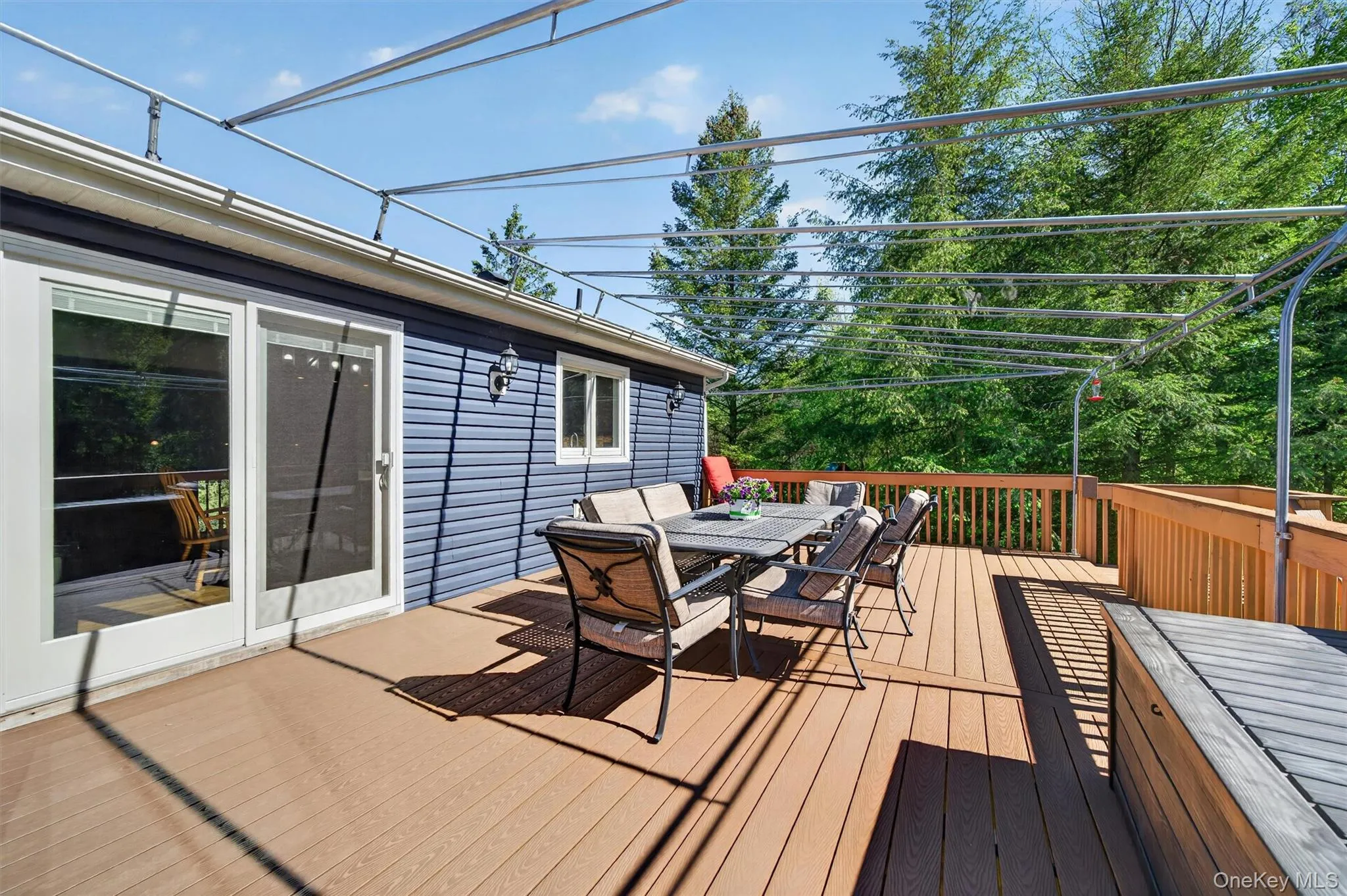 The oversized deck is great for outdoor dining and the awning keeps everyone comfortable outside. The oversized deck is great for outdoor dining and the awning keeps everyone comfortable outside.
