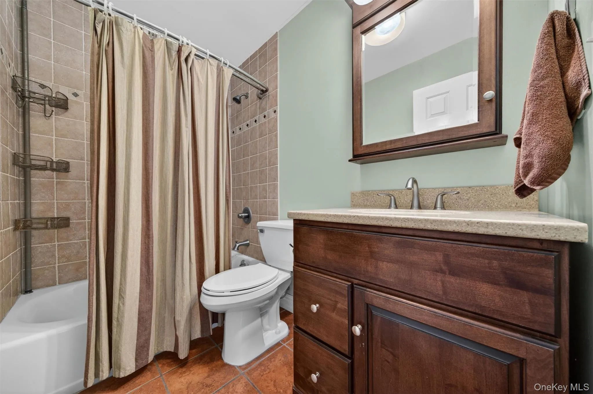 The second full bathroom has a tiled tub and shower The second full bathroom has a tiled tub and shower