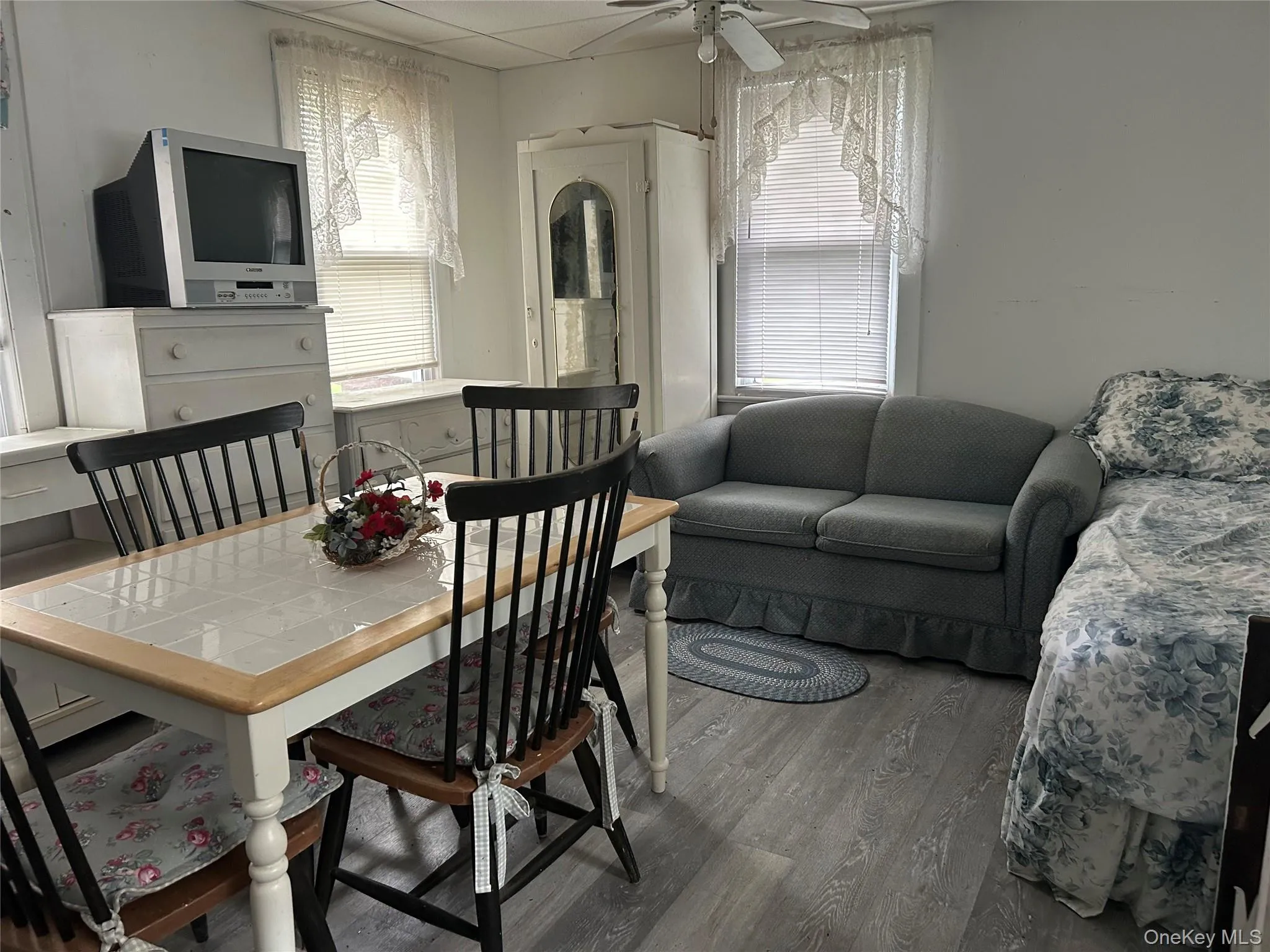 Dining area with wood finished floors, ceiling fan, and healthy amount of natural light Dining area with wood finished floors, ceiling fan, and healthy amount of natural light