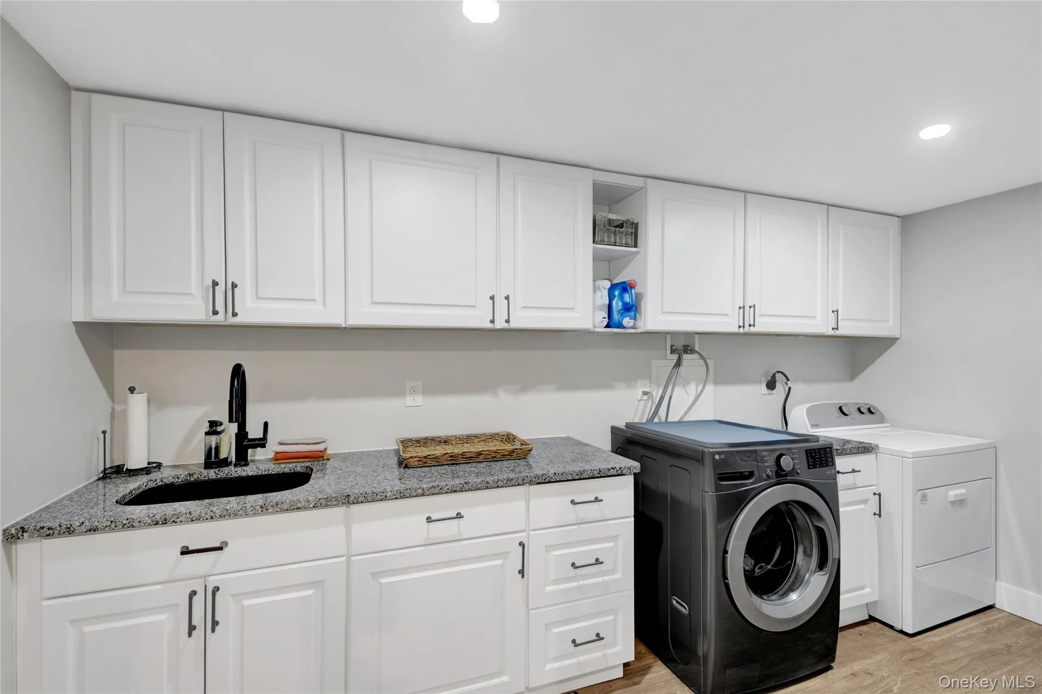 Laundry room off the family room on lower level Laundry room off the family room on lower level