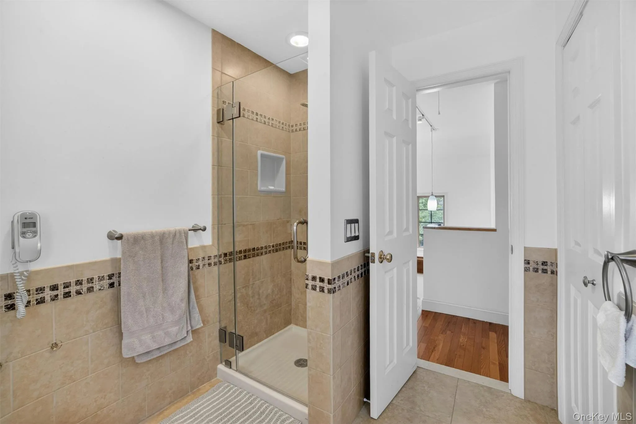 The beautifully updated upstairs bathroom combines modern finishes with clean, timeless design. The beautifully updated upstairs bathroom combines modern finishes with clean, timeless design.