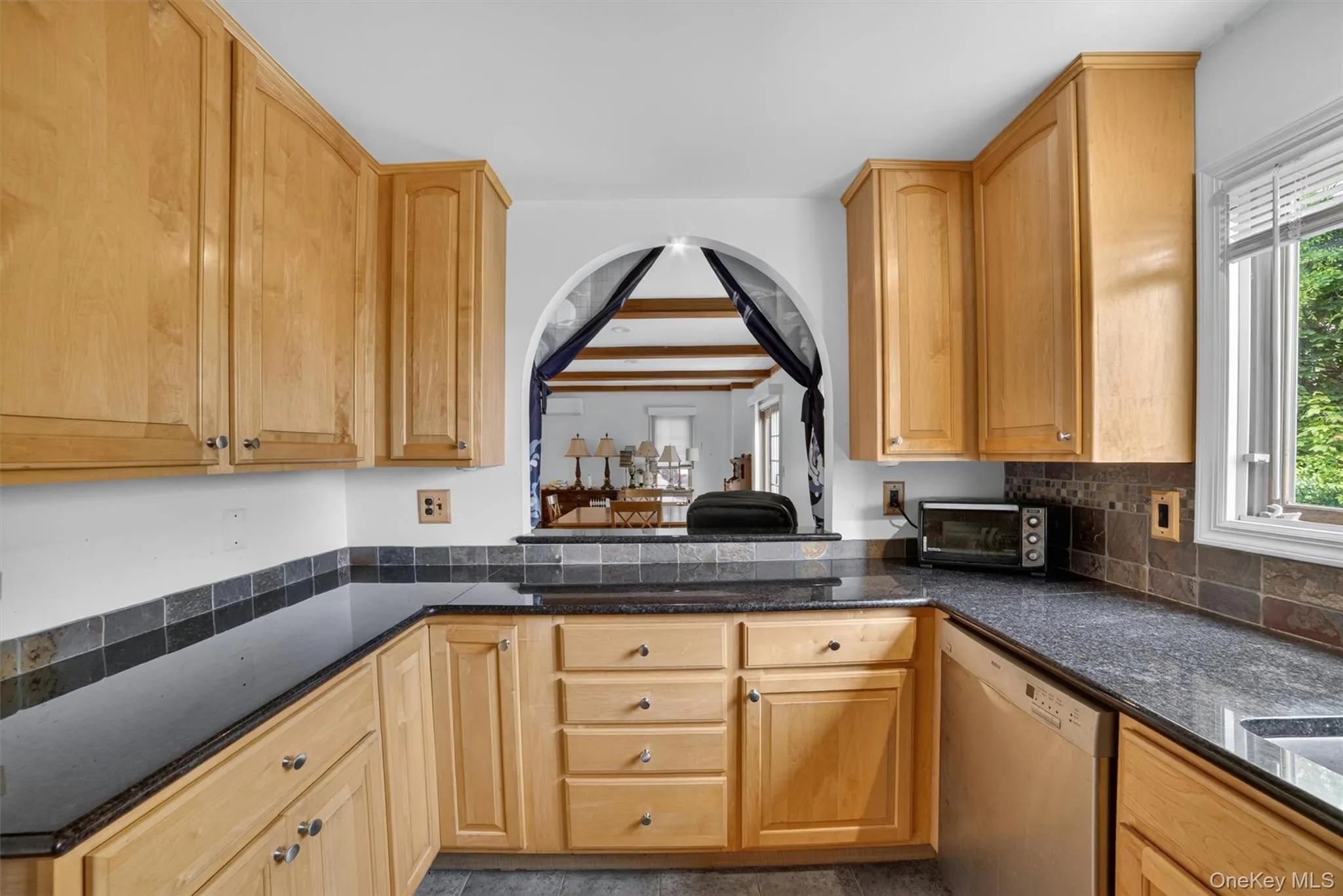 The updated kitchen offers a warm and inviting space with thoughtful finishes, ample cabinetry, and seamless flow for everyday living. The updated kitchen offers a warm and inviting space with thoughtful finishes, ample cabinetry, and seamless flow for everyday living.