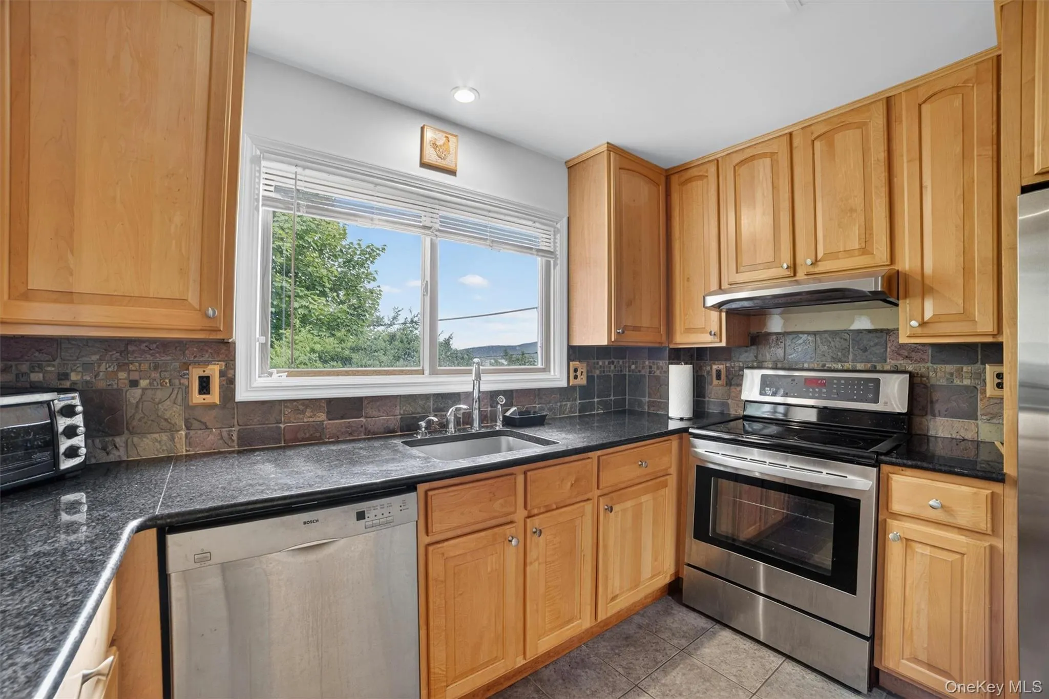 Dramatic five-foot picture window perfectly framing breathtaking river views. Dramatic five-foot picture window perfectly framing breathtaking river views.